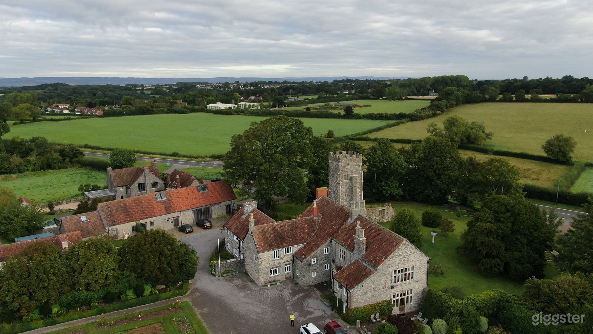 In the foreground is the historic manor house dating back to 1060. Behind it is the 12th Century ruin of the Church of St Helen, to the left is the Conference Centre