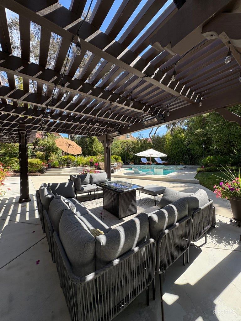  Pergola with outdoor living and fire pit. 