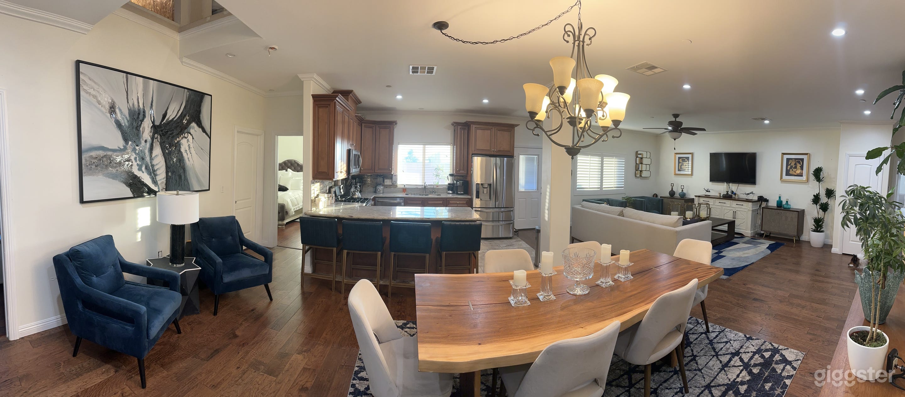 Living room with the view of the kitchen and living room right of the pic.