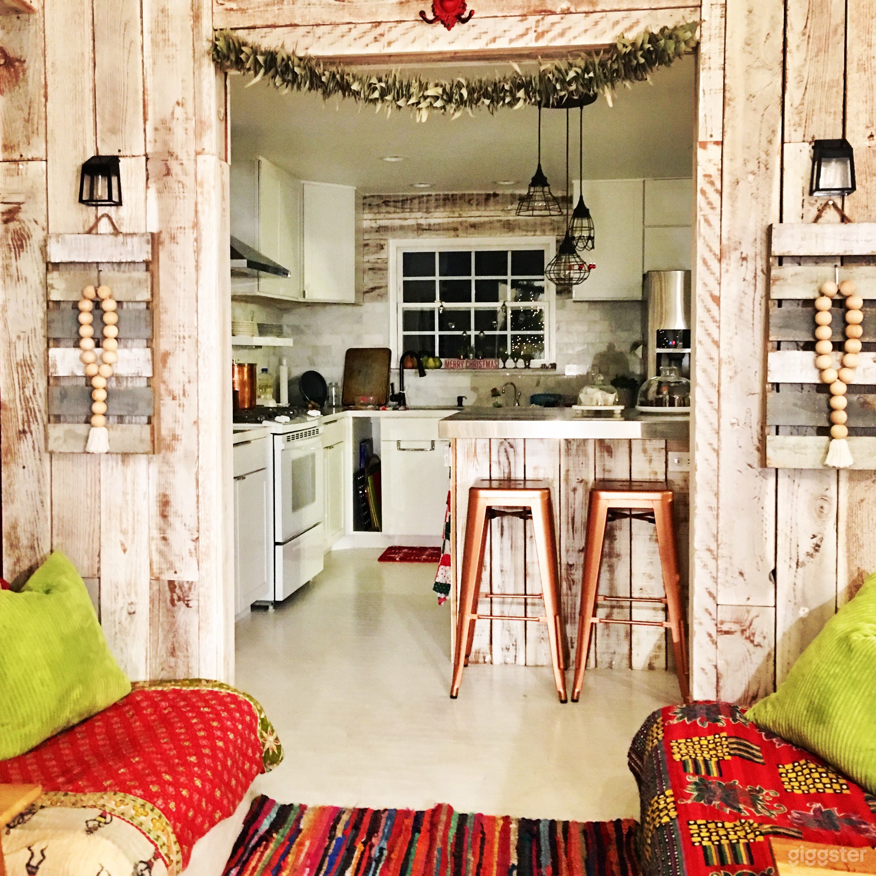 Accent wall natural wood open to kitchen. Copper barstools. Updated window for natural light. 
