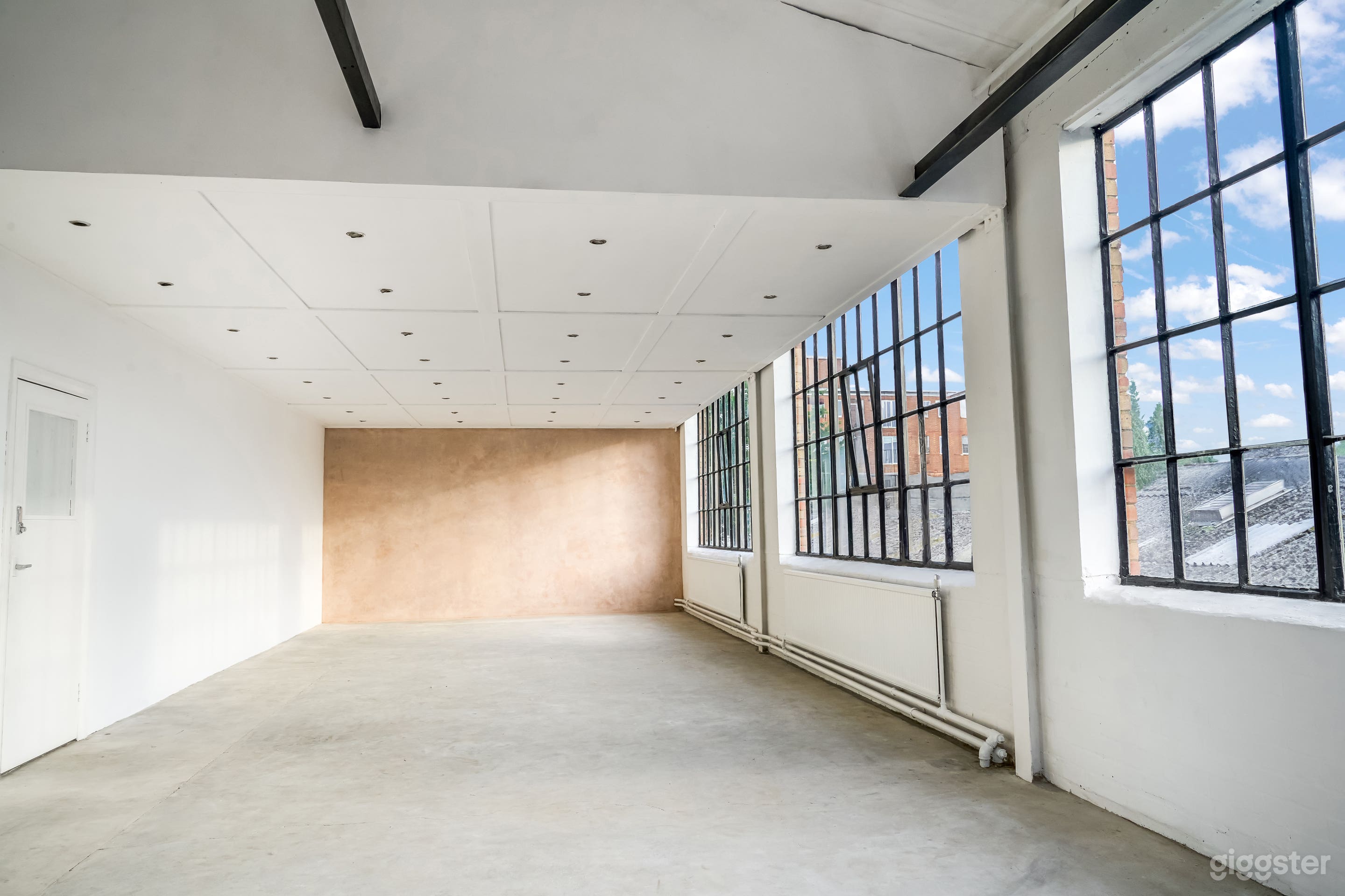 Bright Industrial Photo Studio with Natural Light &amp; Minimalist Aesthetic Photo 2