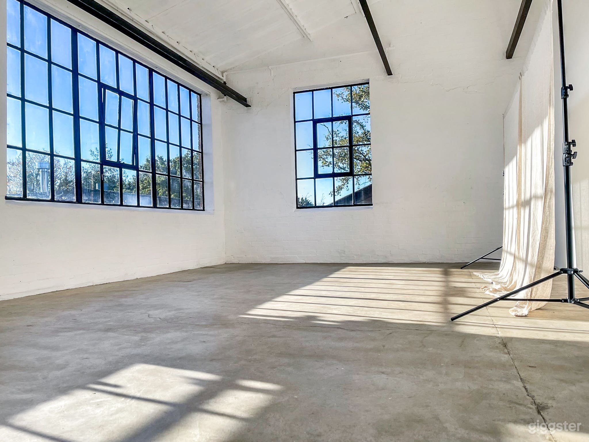 Bright Industrial Photo Studio with Natural Light &amp; Minimalist Aesthetic Photo 3