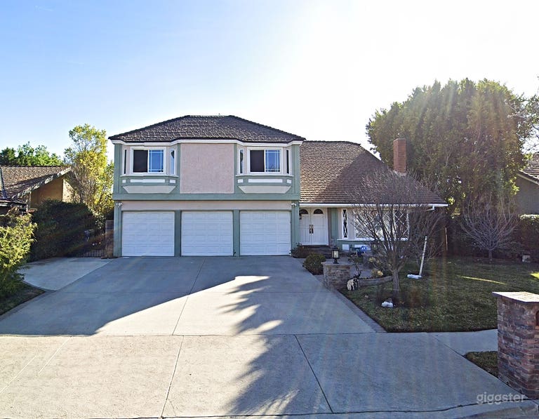  Many vignettes home with huge manicured backyard  