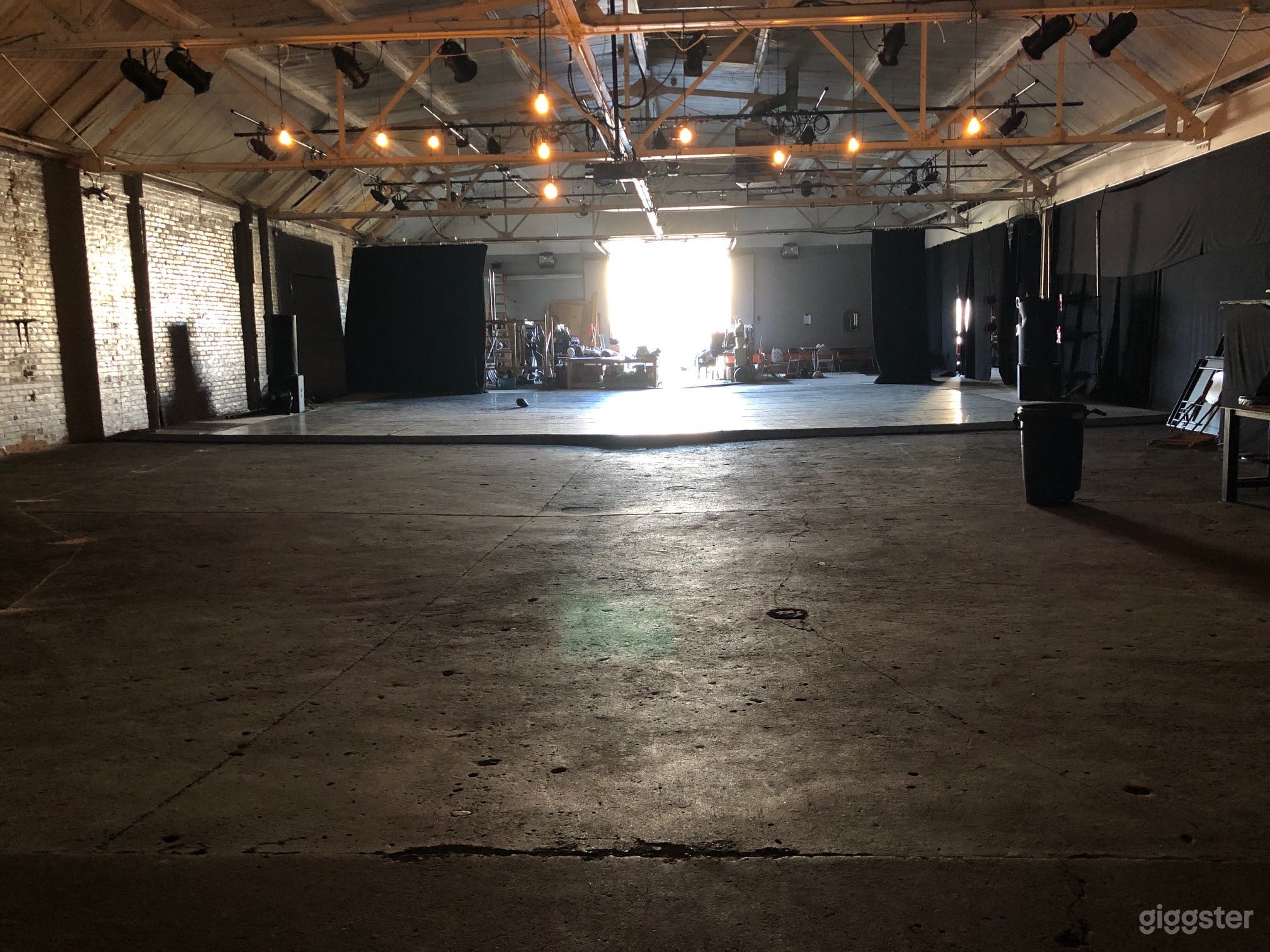 Open warehouse with theatre lighting grid and dance floor
