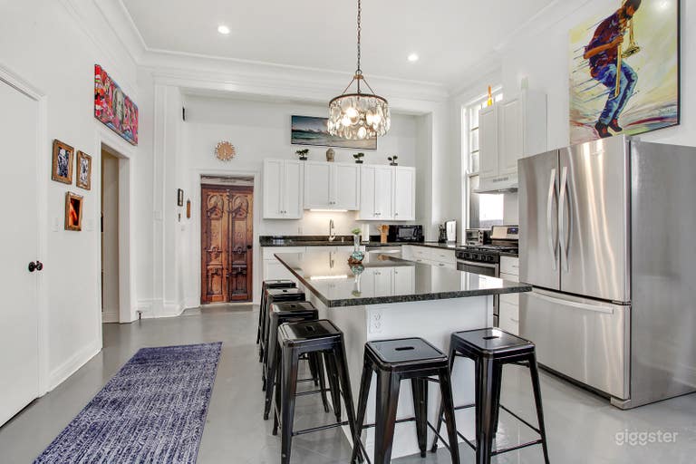  Stainless steel appliances, white walls &amp; cabinets with Eclectic decor  