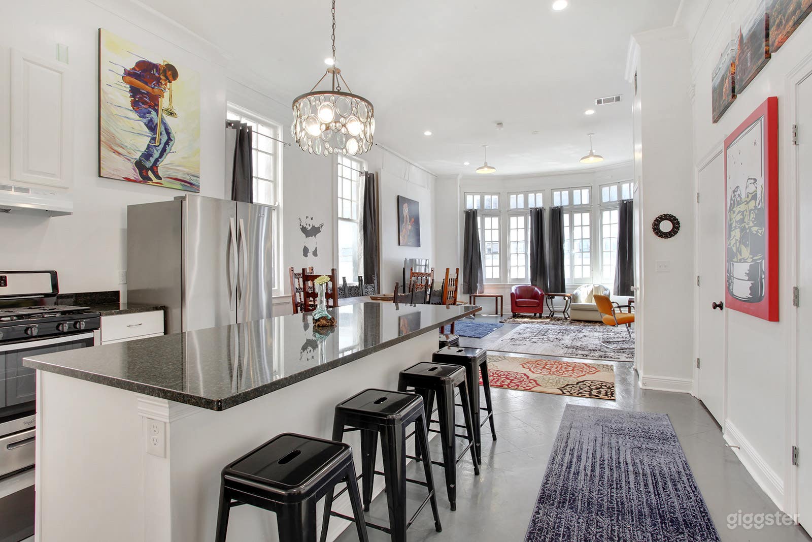Chefs kitchen open to living area with 6 seat island and 10 seat dining table, bay windows overlook streetcar route on Carondelet St.
Half bath off kitchen.