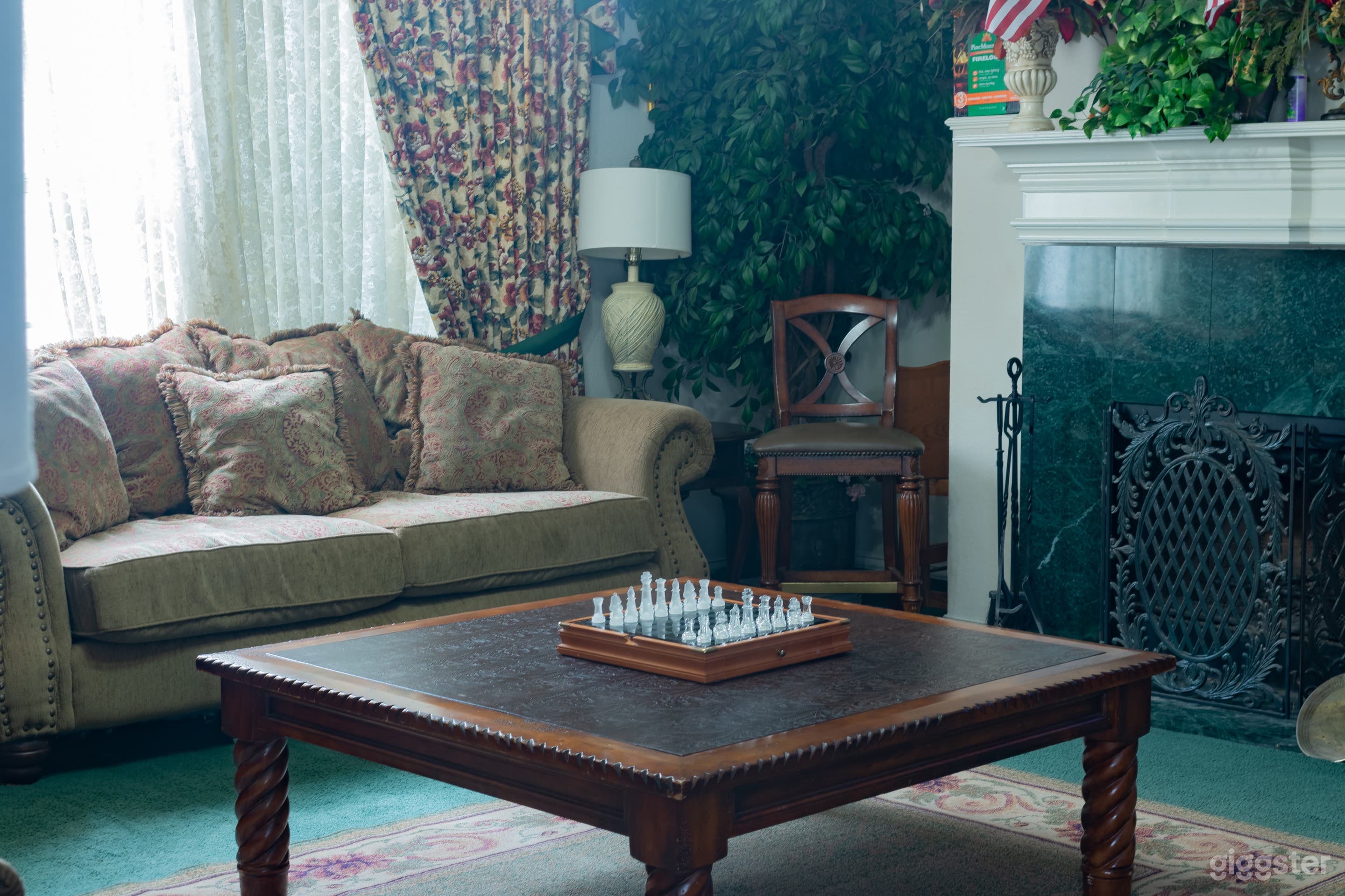 living room, green carpet and traditional 90s fireplace with furniture to match