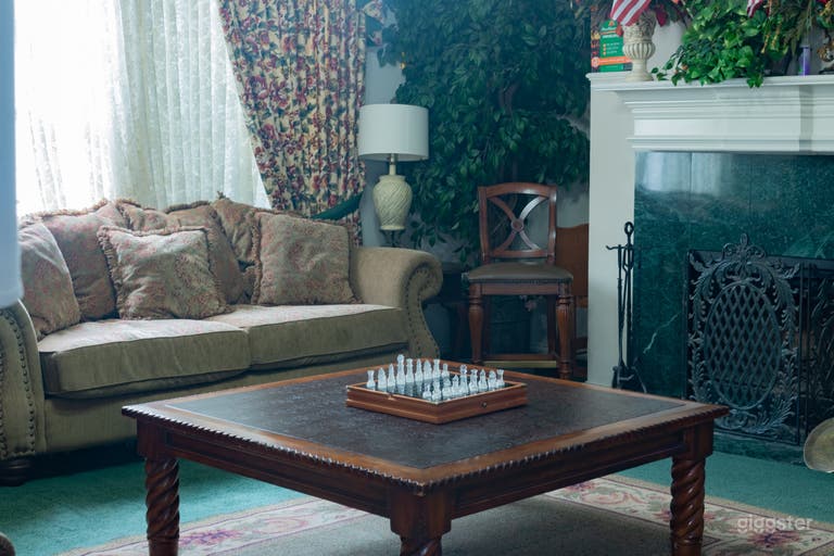  living room, green carpet and traditional 90s fireplace with furniture to match 