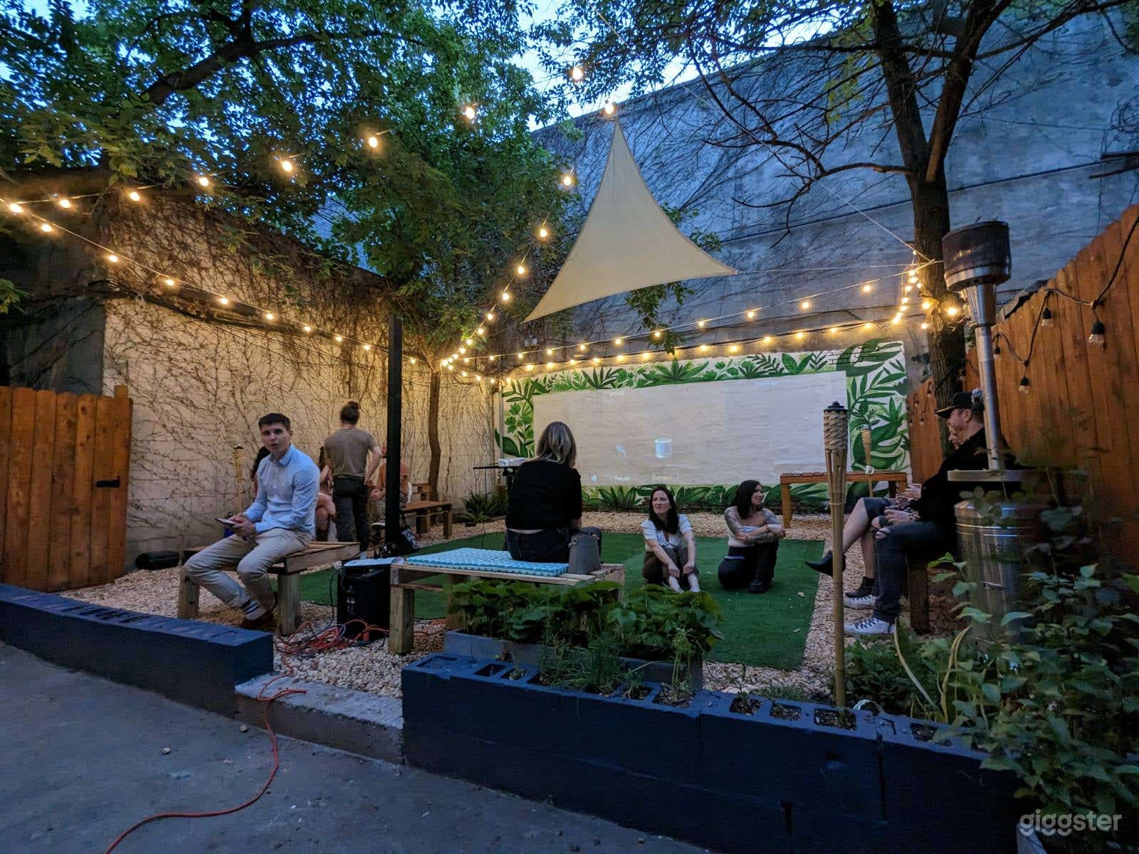 Beautiful back yard space with over head lights and projection wall 