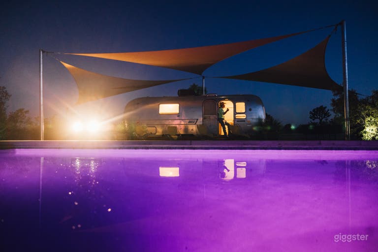  Pool with airstream at night  