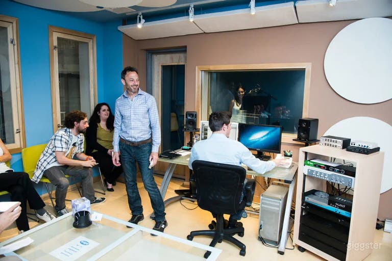  Studio B: Spacious acoustically treated studio space. (Professional audio/recording equipment, Client chairs/sofas, Audio engineer station) 