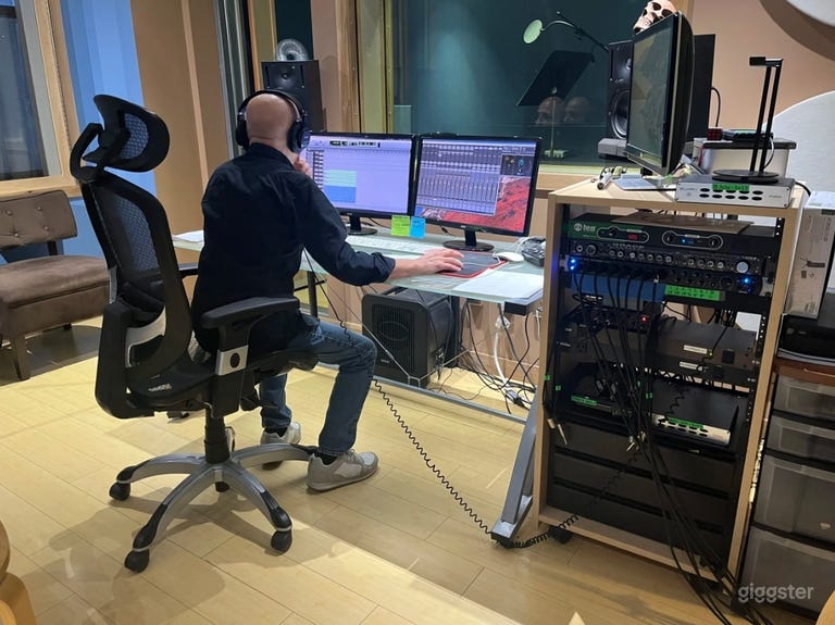  Studio B: Spacious acoustically treated studio space. (Professional audio/recording equipment, Client chairs/sofas, Audio engineer station) 