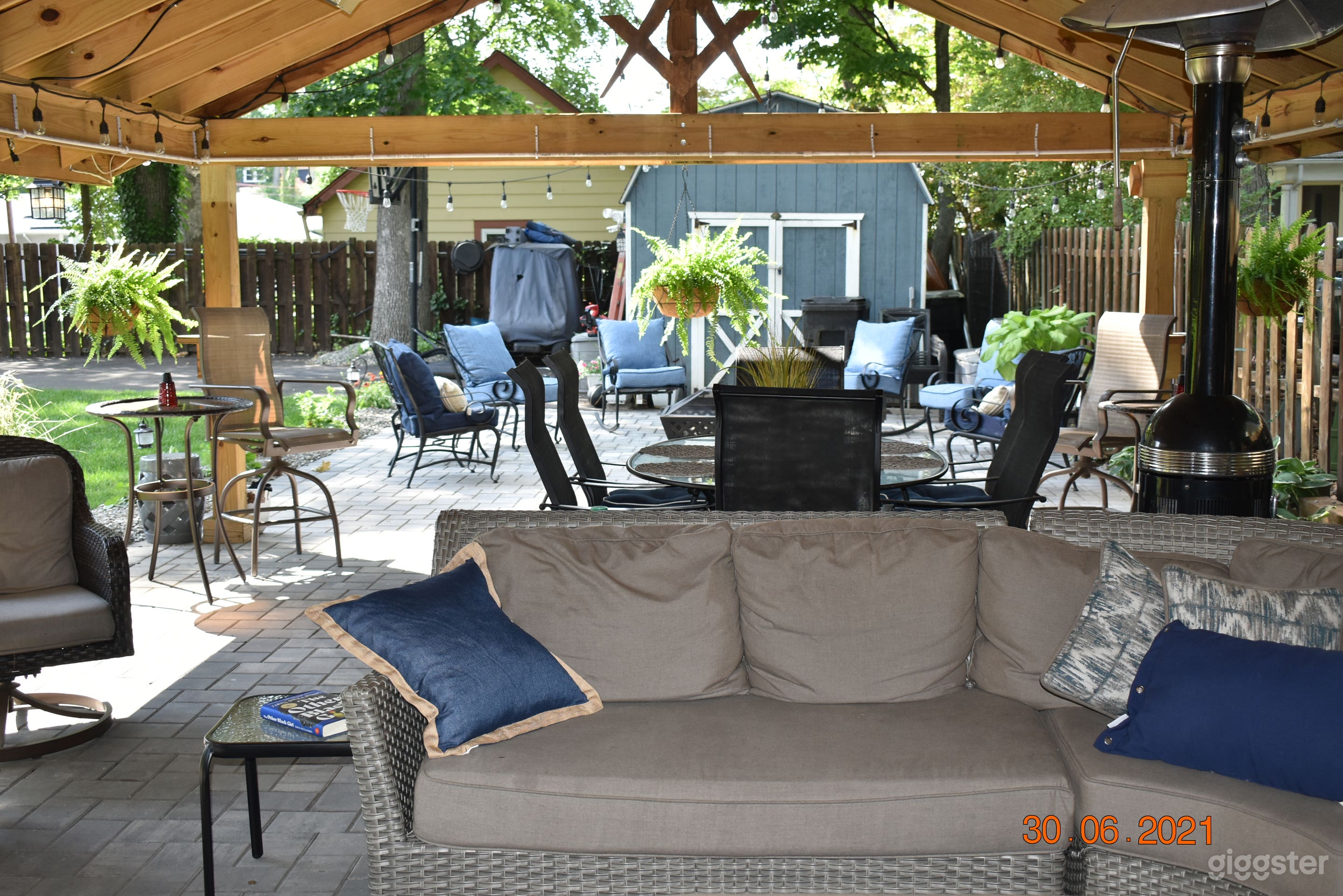 Outdoor living/dining area that has additional heating and cooling mechanisms to maximize east coast outdoor living.