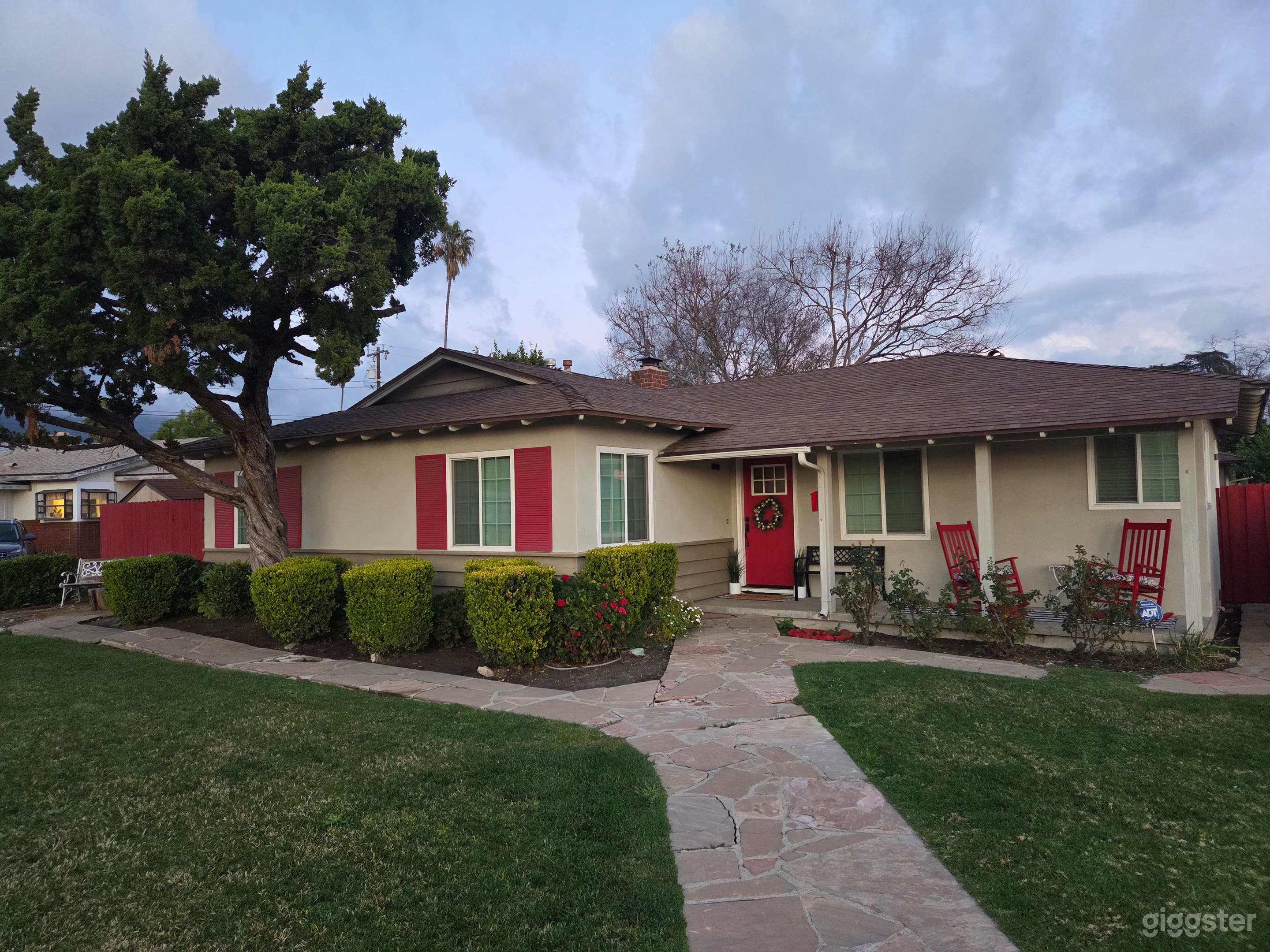 Suburban corner raised house on cul-de-sac large windows Photo 1