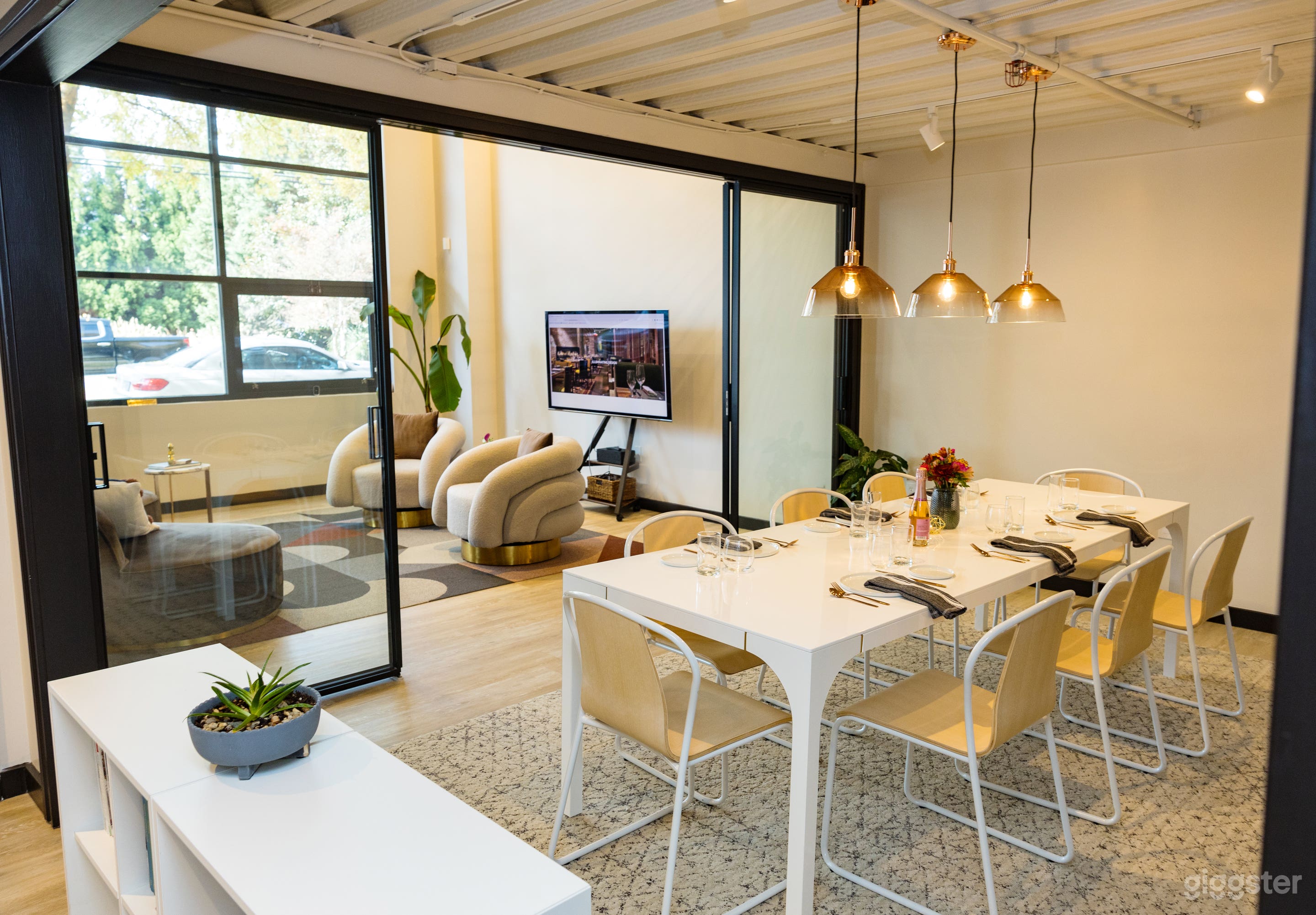 Dining/Conference Room opens to Living Room/Lounge with sliding glass doors. 65" TV is mobile and can be used in Living or Dining Room