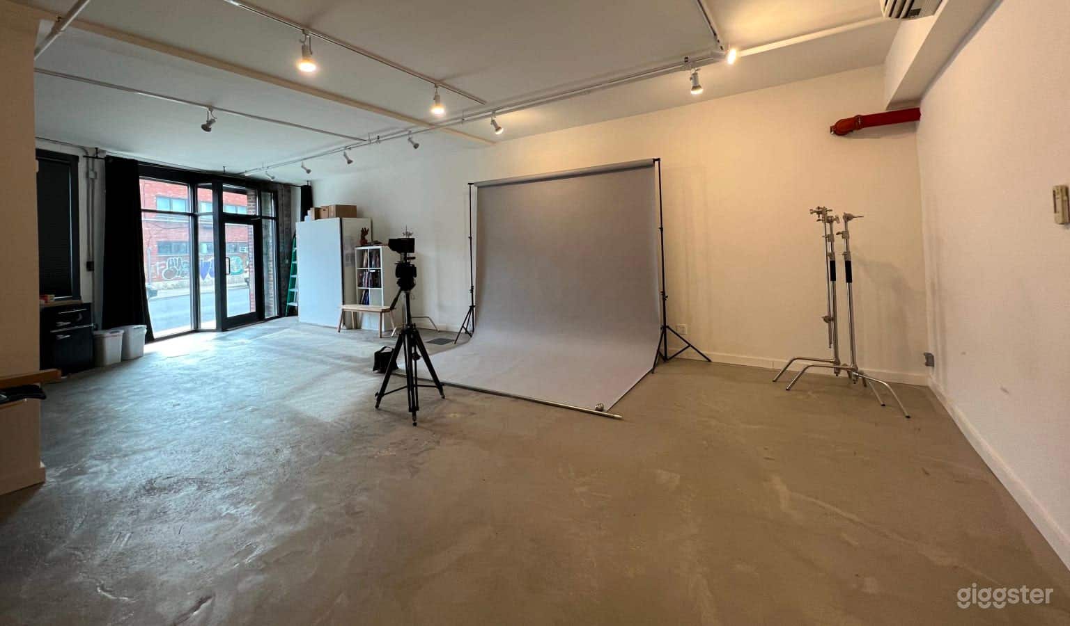 large area for setting up a backdrop, with plenty of room for lights and gear