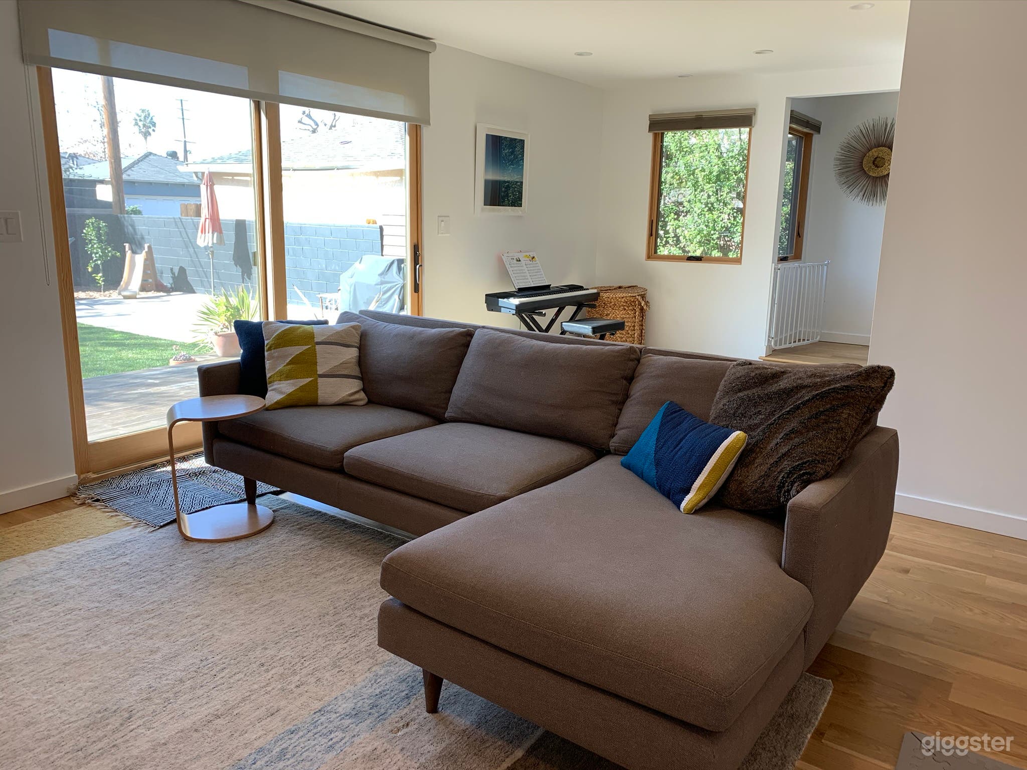 Couch TV area with view of backyard