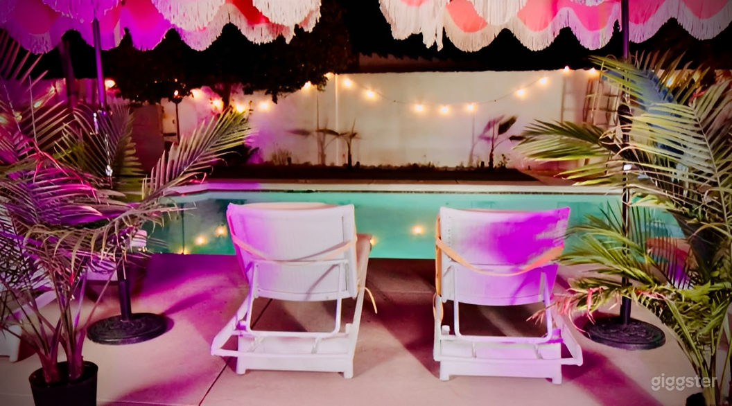 Pastel Pool Oasis with Palm Views Photo 2