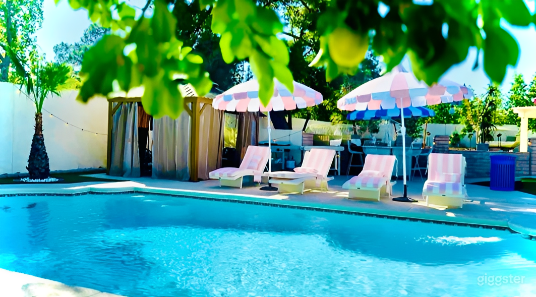 Pastel Pool Oasis with Palm Views Photo 4