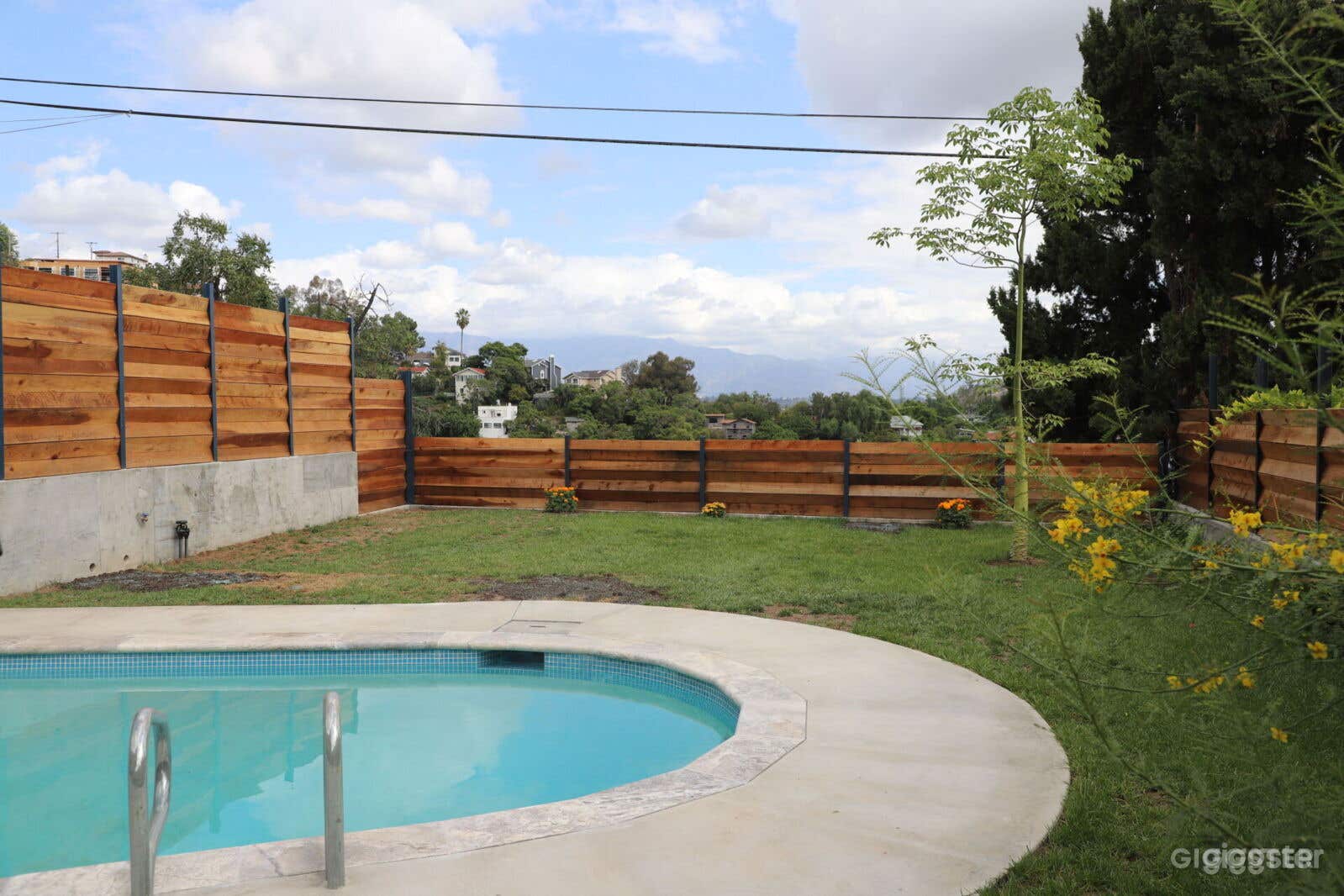 360 Degree Hilltop View Backyard with an Oval Pool Photo 1