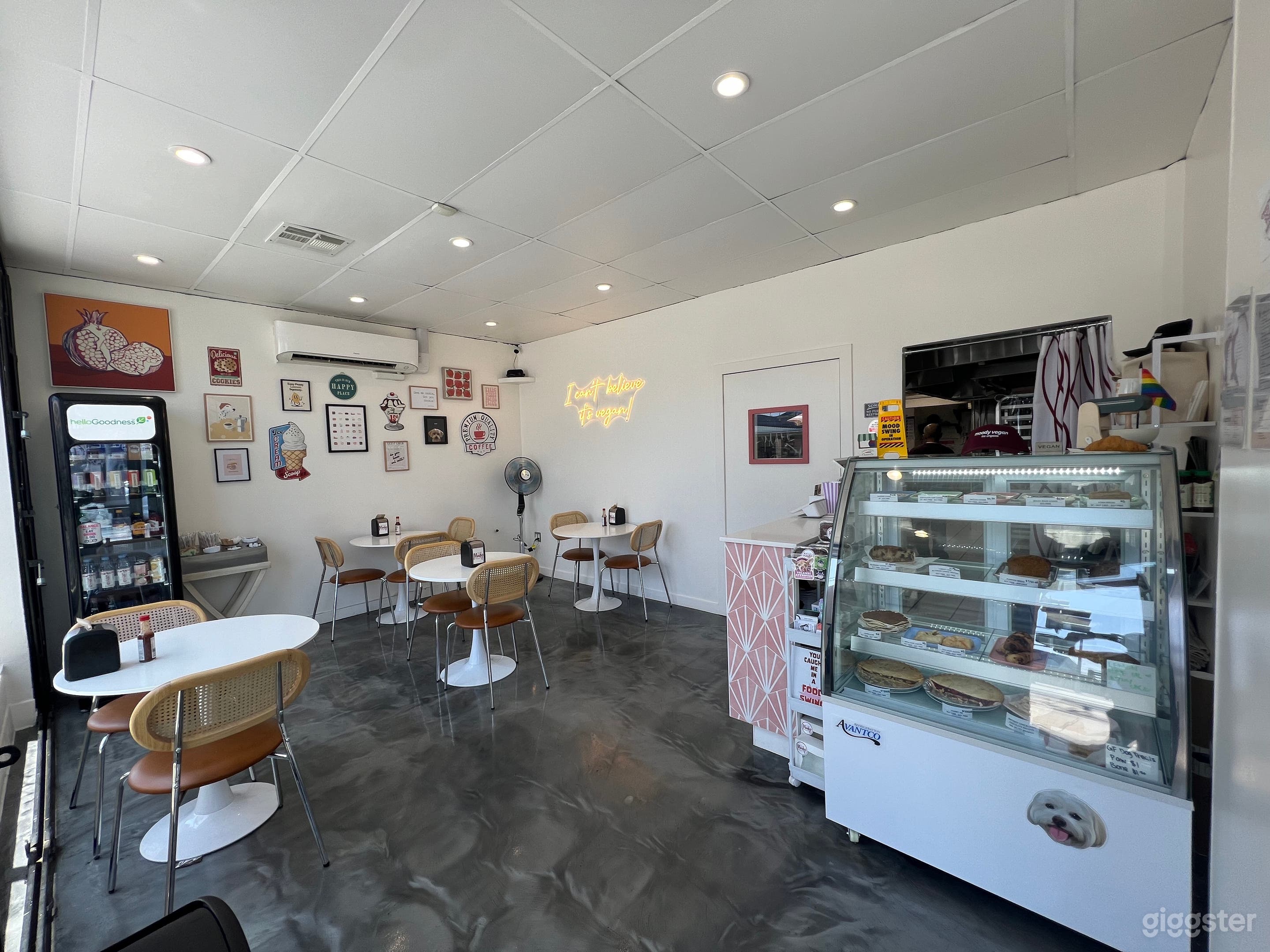 Inside view when you first walk in! Very cute back art wall and neon light. Beautiful tile pops out! 