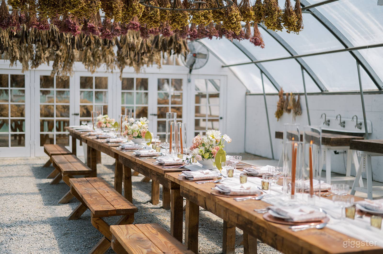 Included in the Garden House are seven rustic  wooden tables accompanied by fourteen wooden benches. 