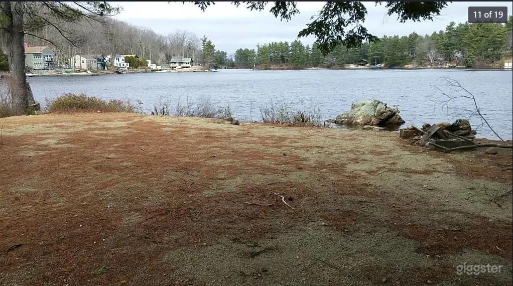 View of the flat beach overlooking the lake. Crossing past the trees you'll be in NH!
