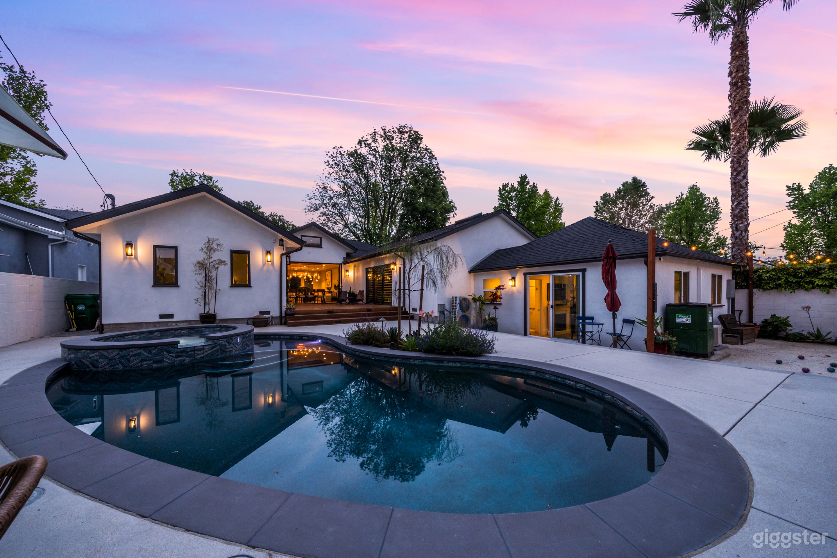 Closer look at the pool with the property in the background