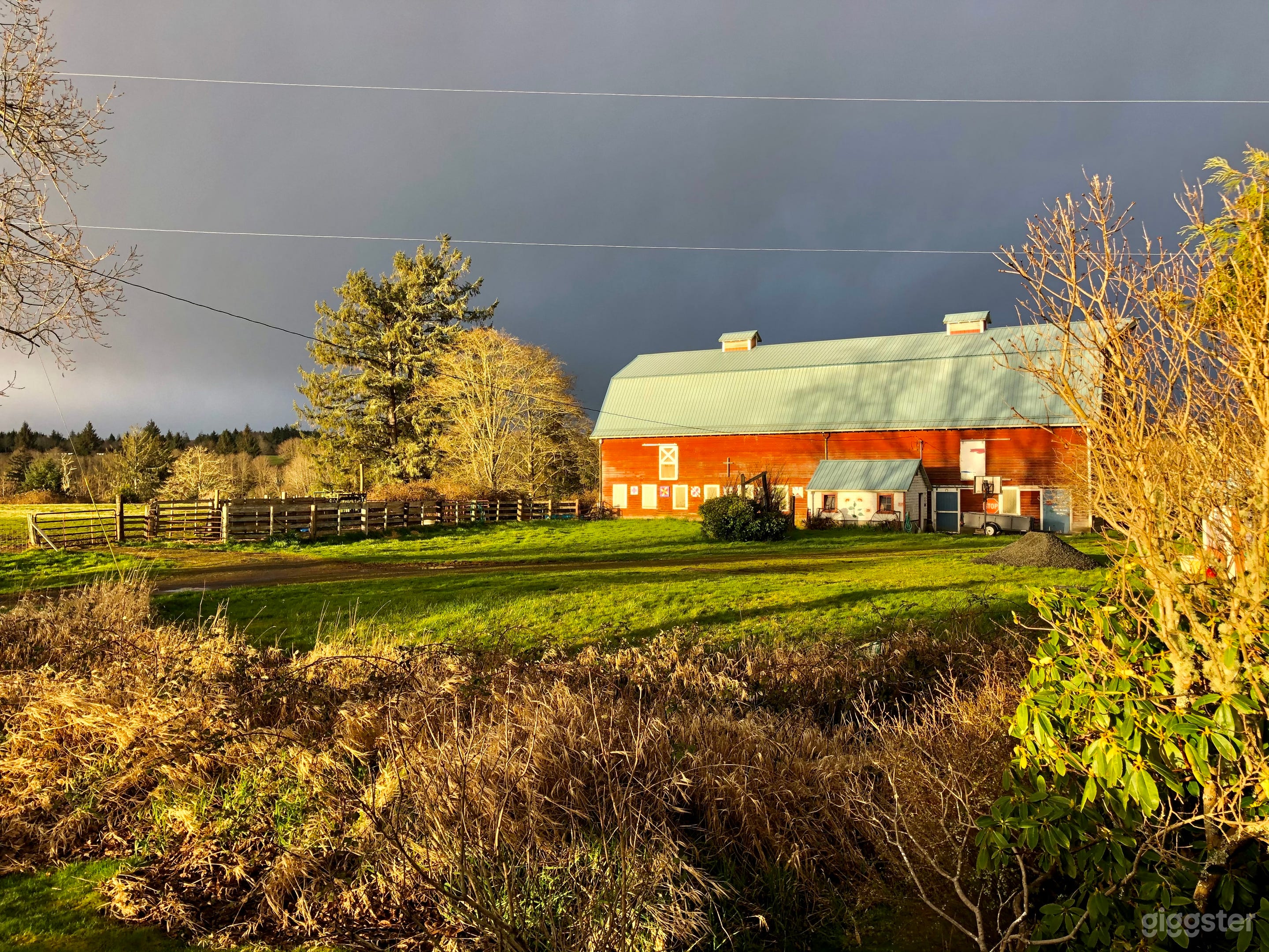 Looking west at the barn and tack shed from deck of house.