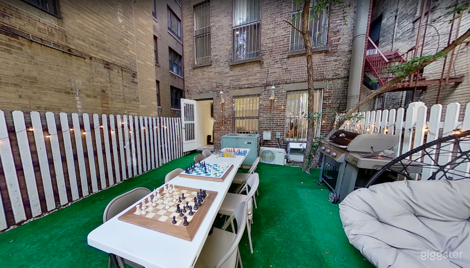 Beautiful Outdoor Backyard with a Grill and Swings 