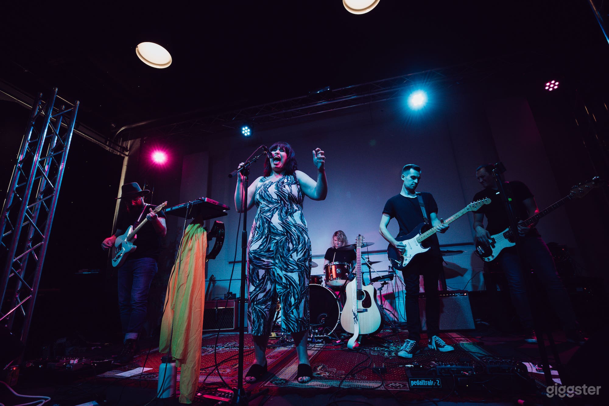 Stage with minimal lighting.