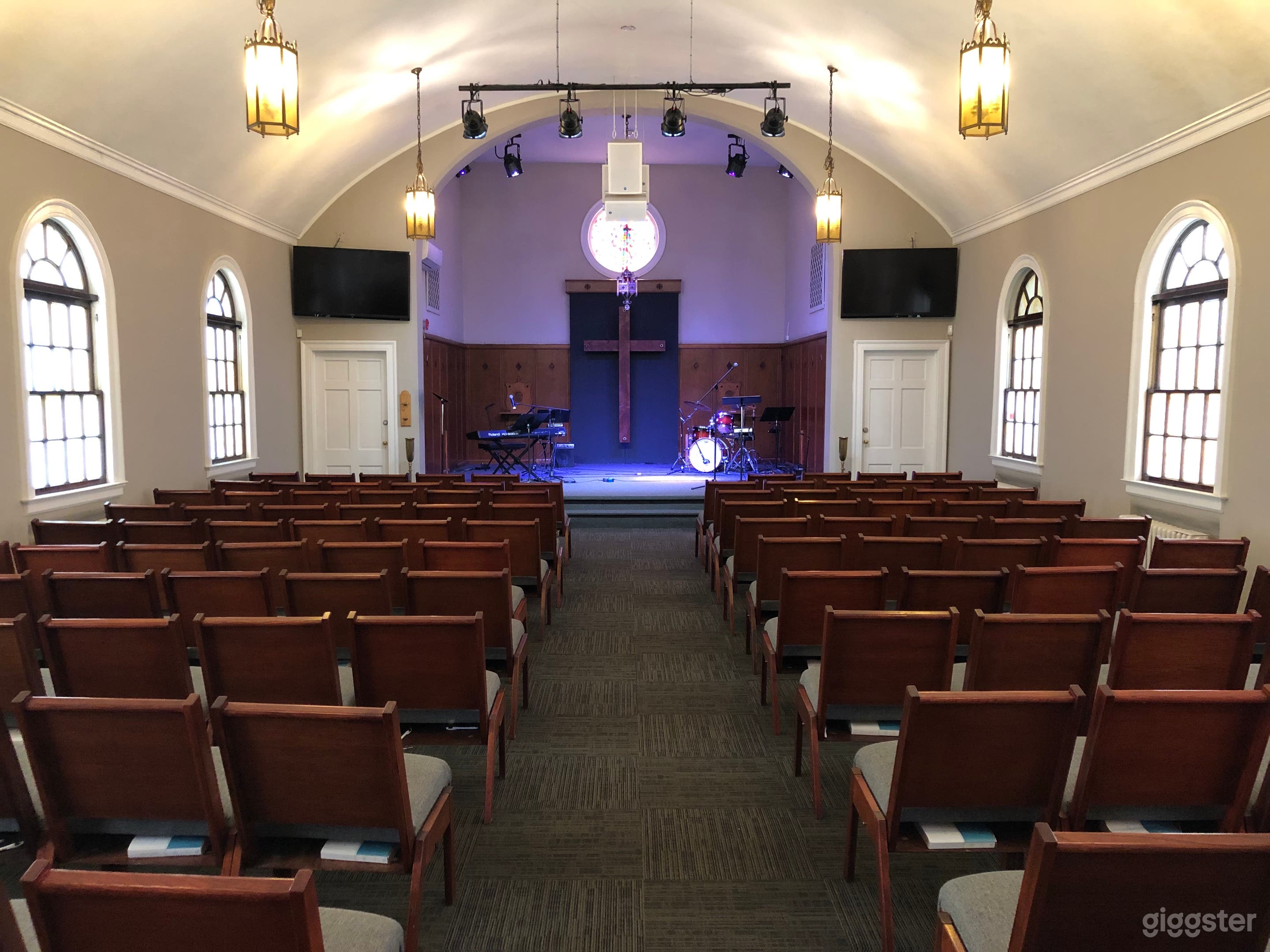 View from the back of the sanctuary looking at the stage of the church.