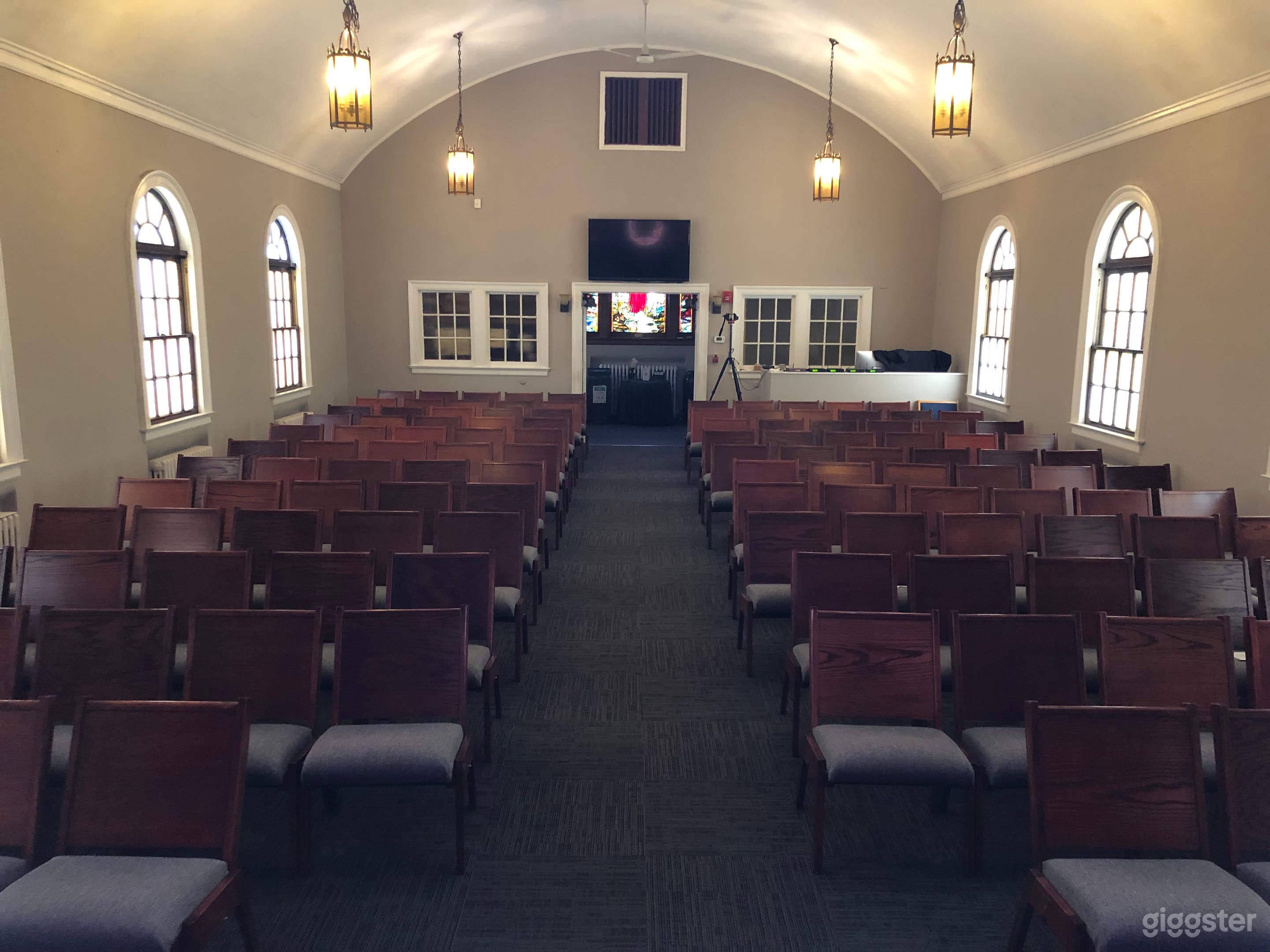 View from the stage looking out at the audience. Note the number of chairs.