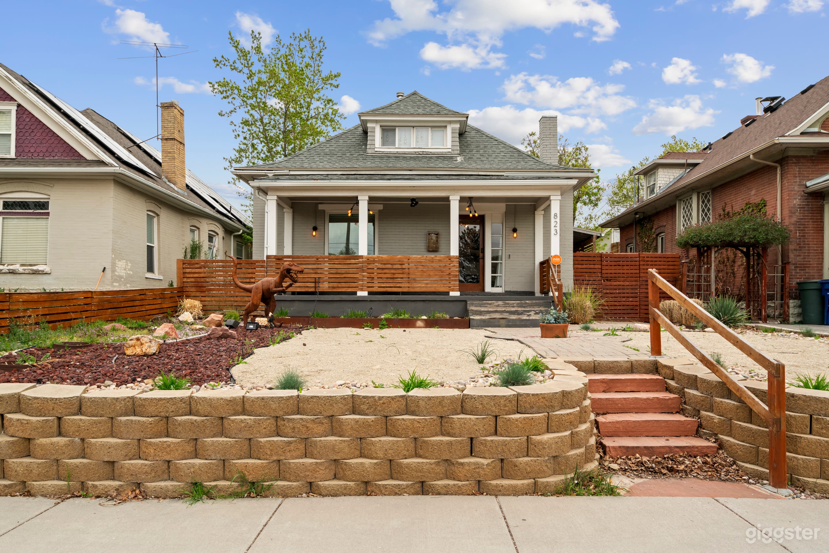 This beautifully preserved 1896 Victorian home brings curb appeal and creativity together. The front façade features a classic covered porch, updated with modern wood slat accents, perfect for porch scenes, heartfelt interviews, or establishing shots. 
