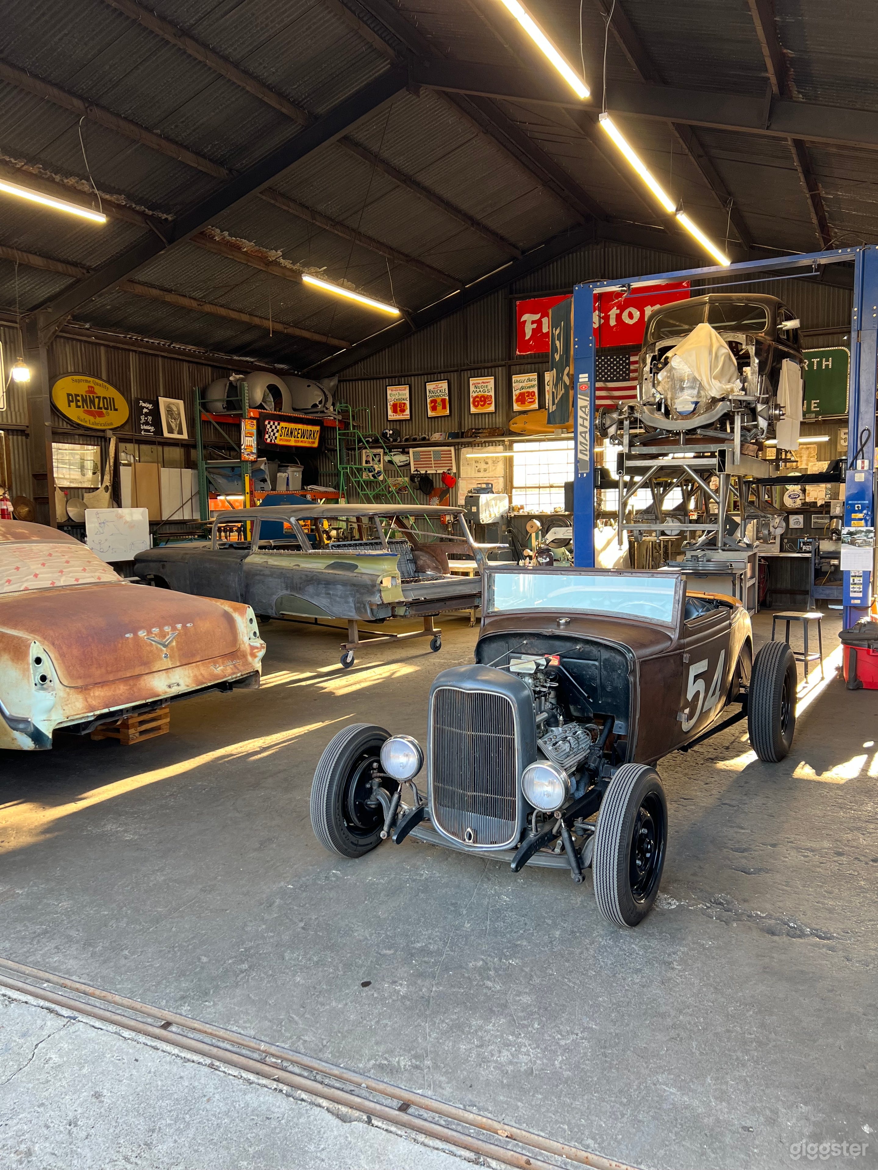 1930’s-1970’s Car Restoration Shop Photo 1