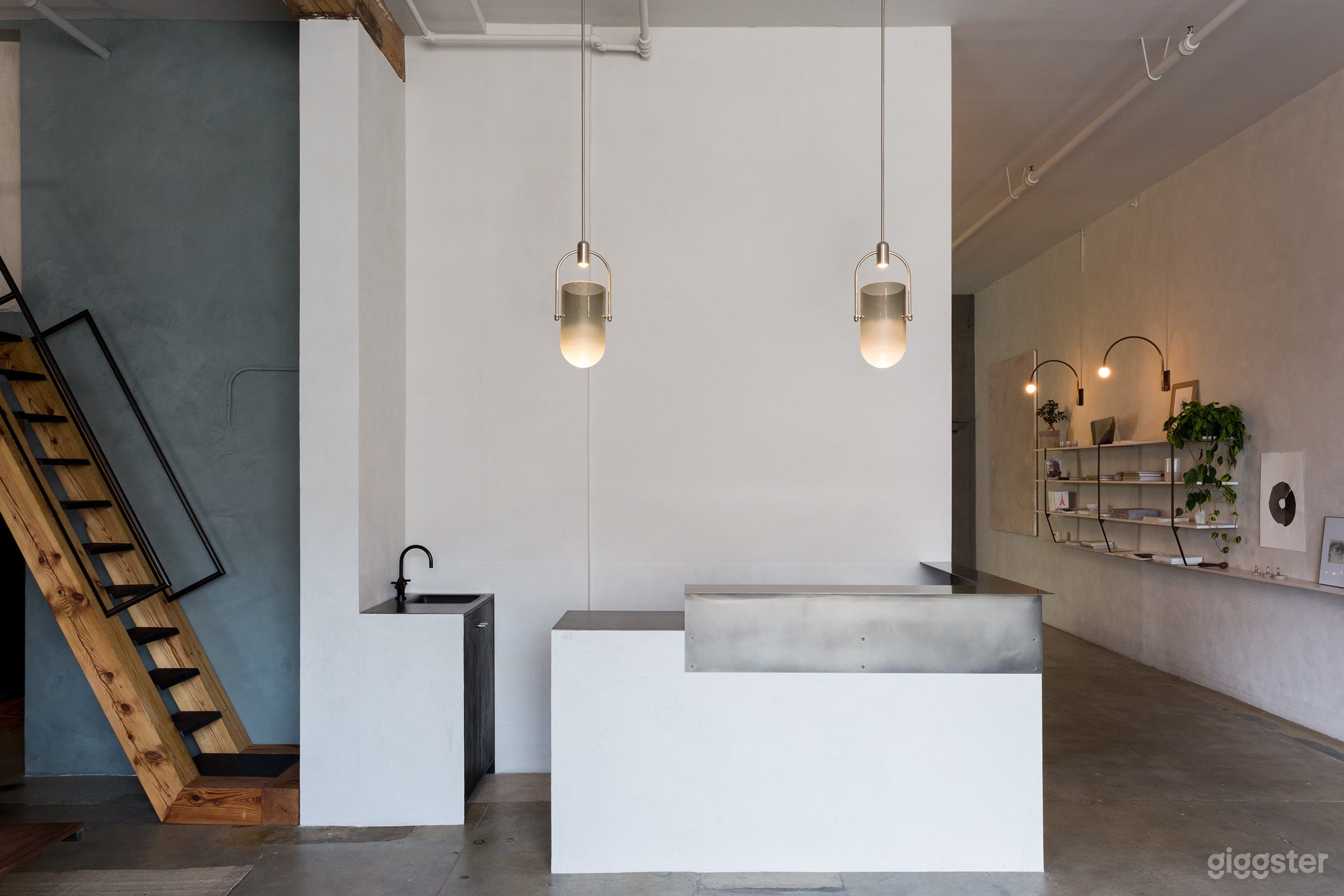 The full bar features an ice maker, freezer, and refrigerator, along with an extensive glassware collection