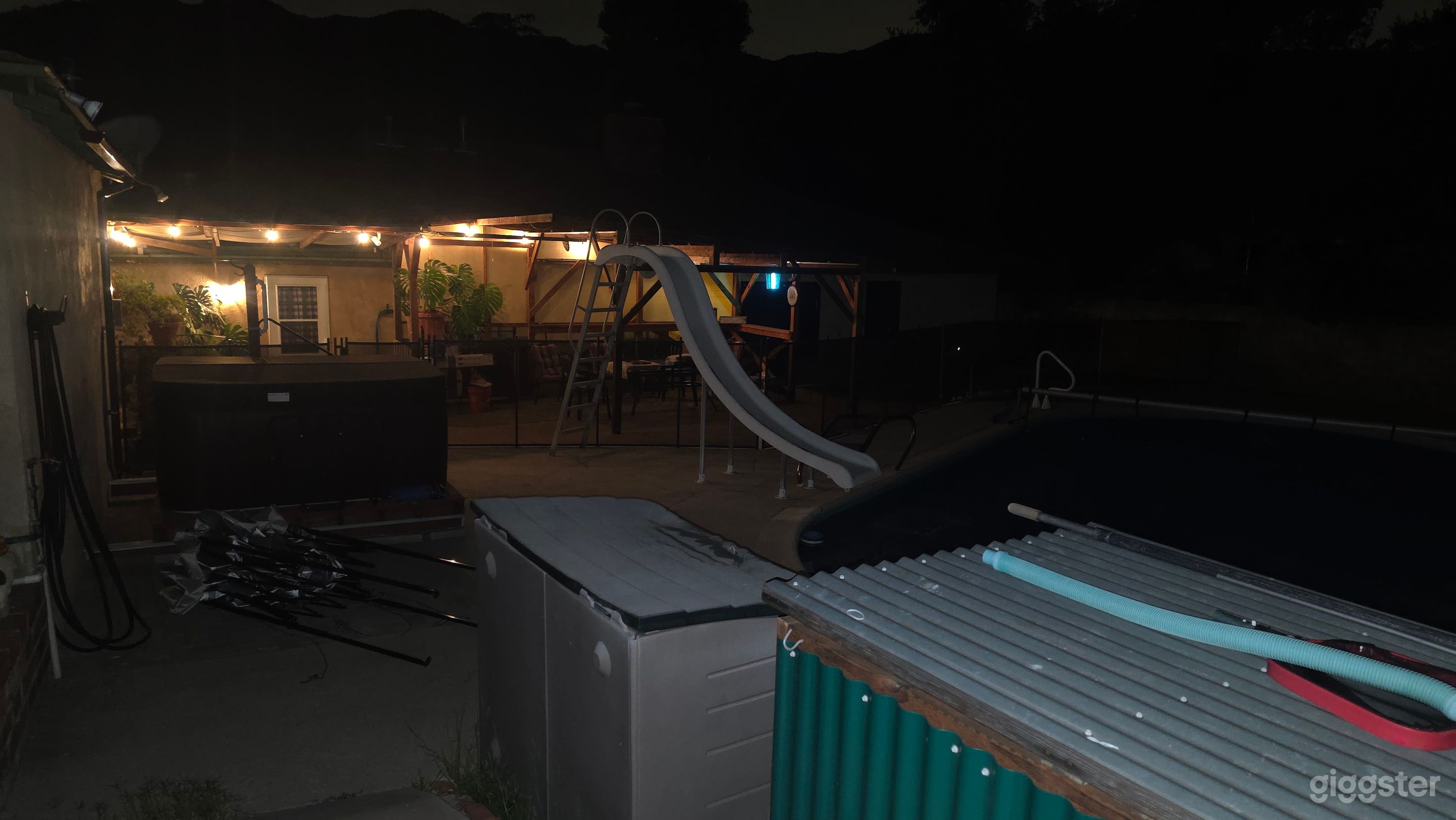 Backyard with jacuzzi, pool, and pool slide. Photo 4