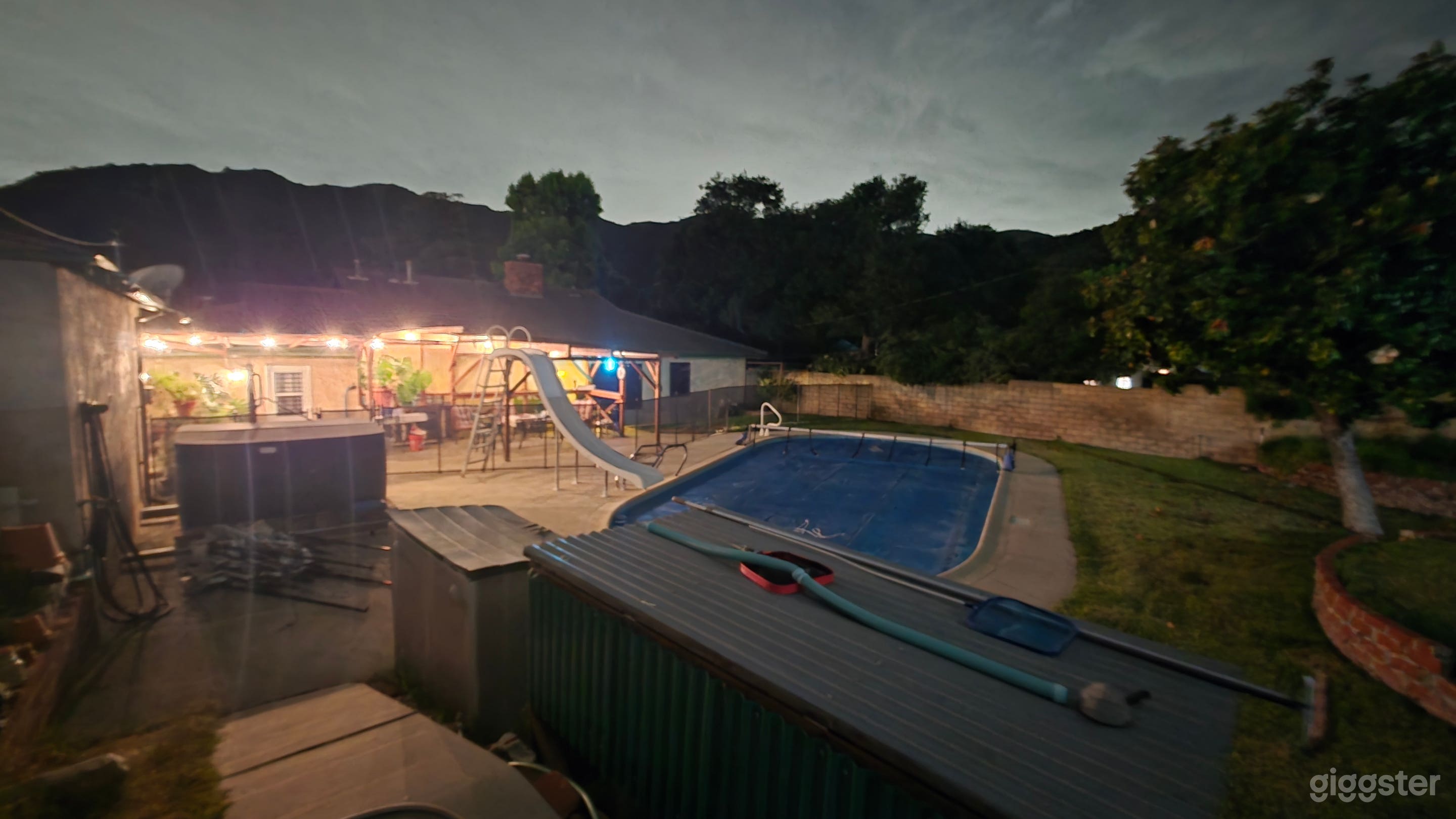 Backyard with jacuzzi, pool, and pool slide. Photo 2