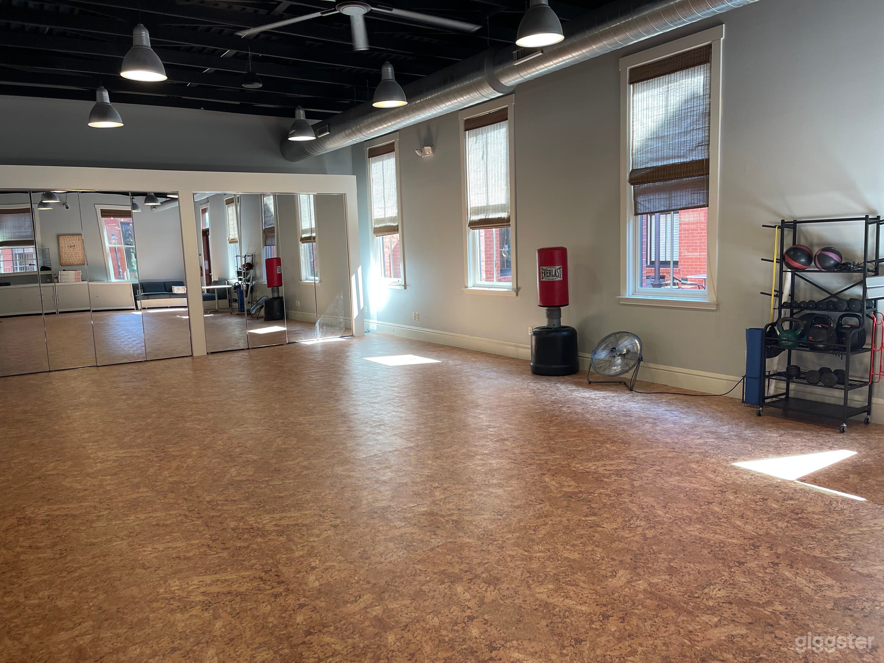 The floor is a warm new cork floor.  We have folding banquet tables and seating for 40.  