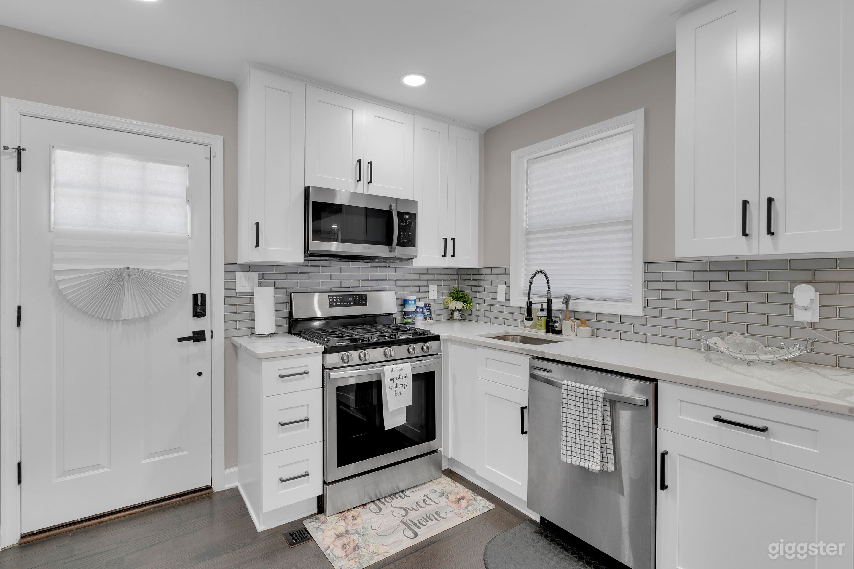 White kitchen with stainless steel appliances 