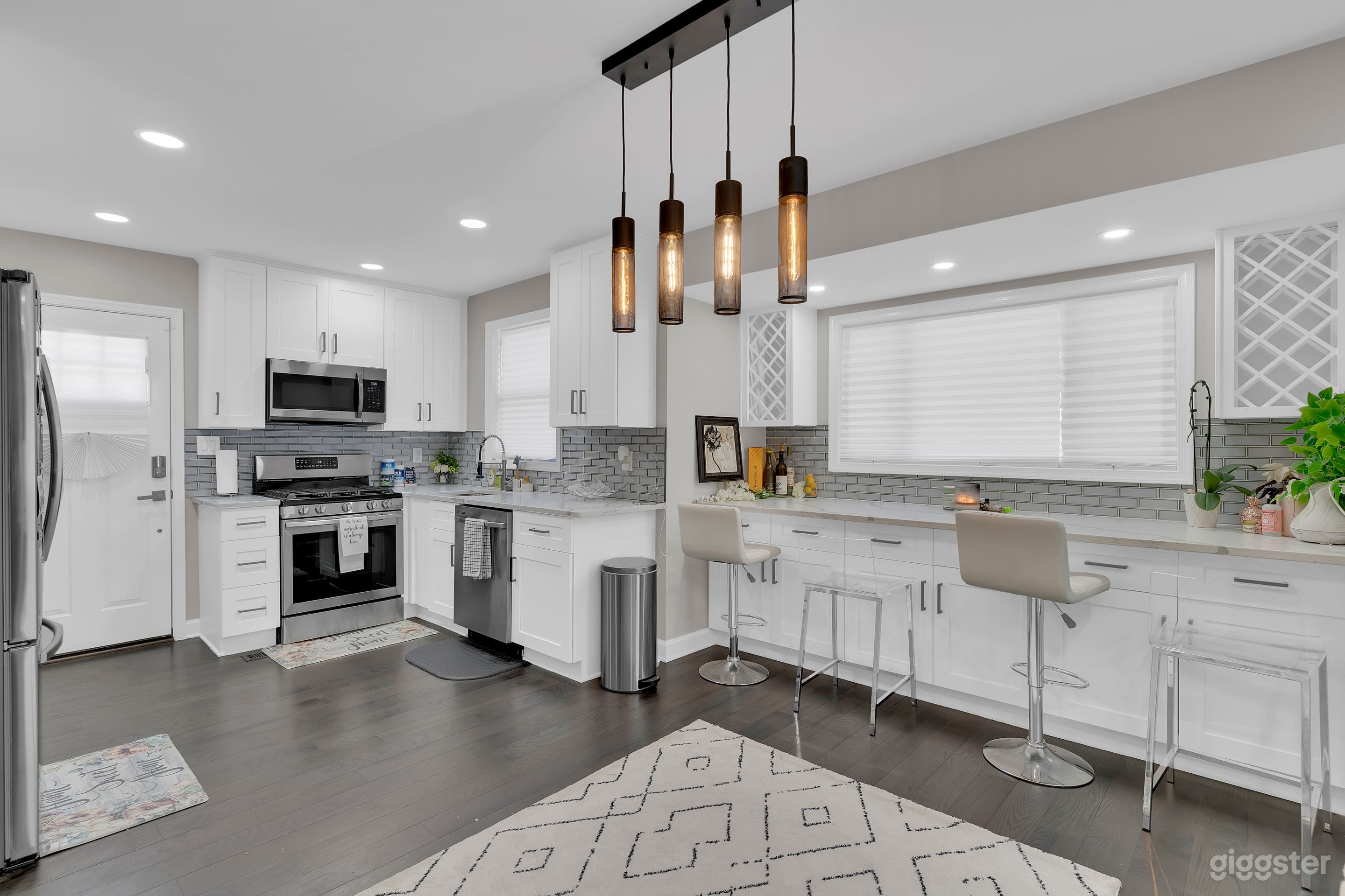 Newly renovated White Kitchen with stainless steel appliances, open floor plan, coffee bar and wine bar. Great for photoshoots, interviews, podcasts and more!