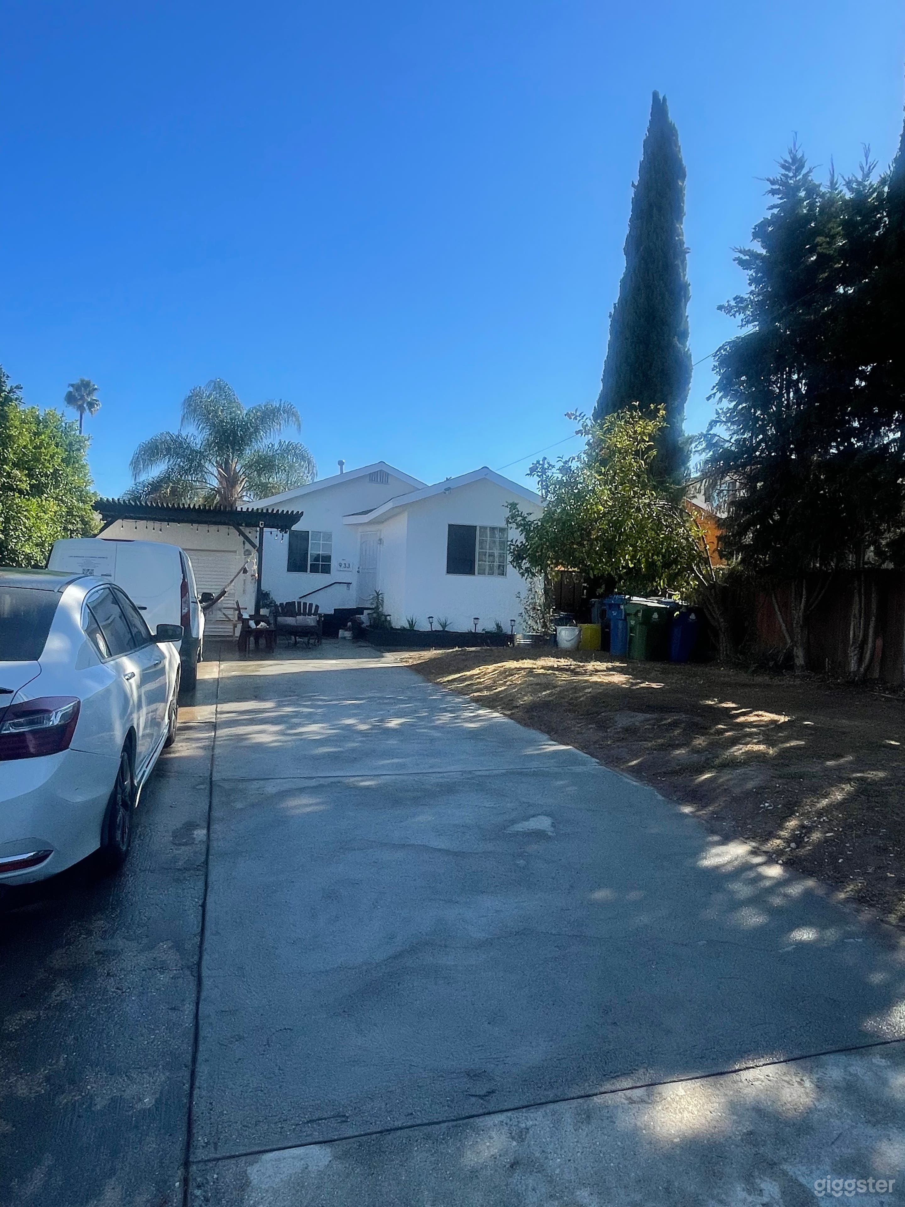 The front yard of this charming home is perfect for filming, offering ample space for setting up movie trailers and equipment. With its open layout, it provides an inviting backdrop for various scenes.