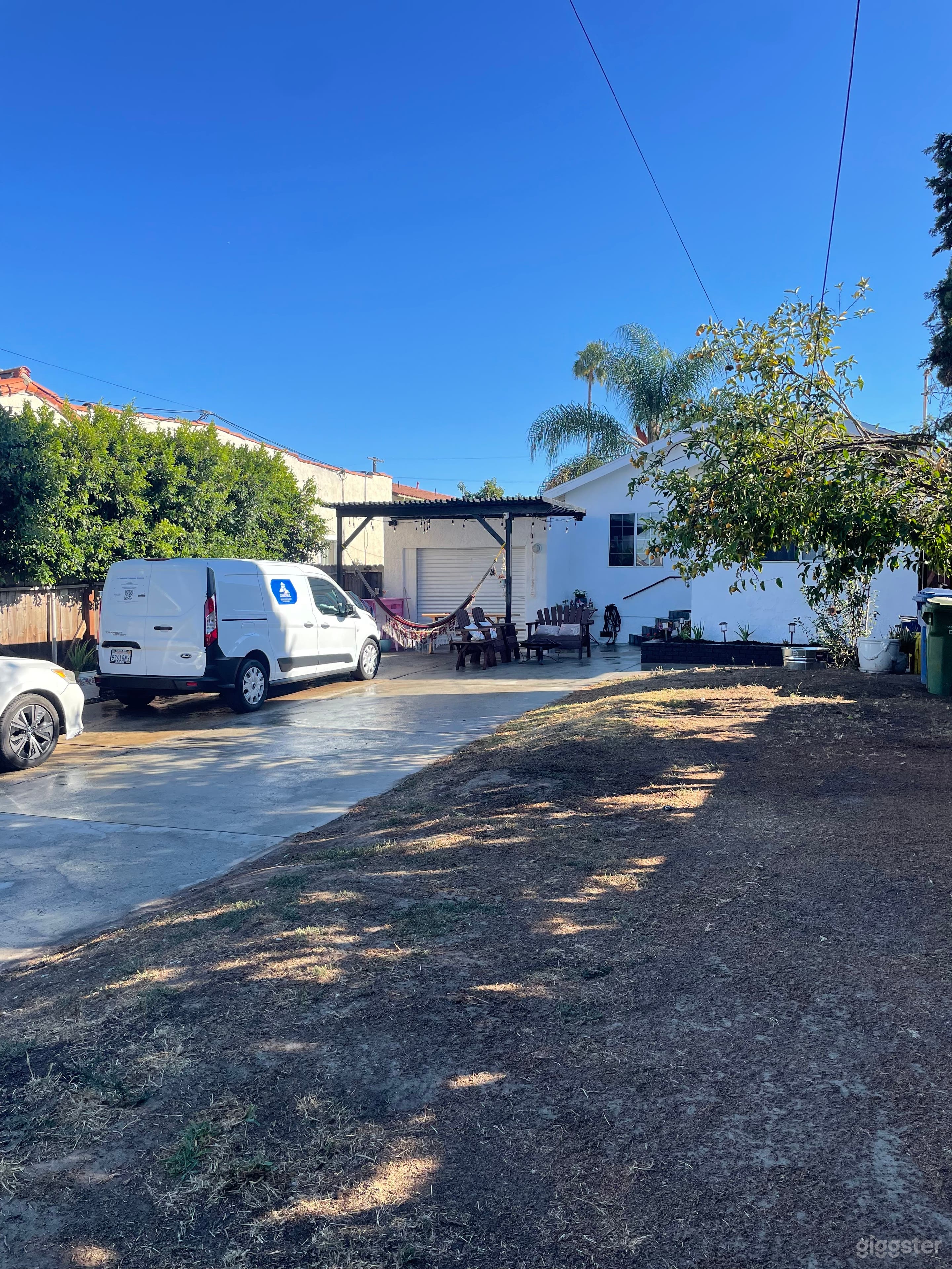 The front yard of this charming home is perfect for filming, offering ample space for setting up movie trailers and equipment. With its open layout, it provides an inviting backdrop for various scenes.