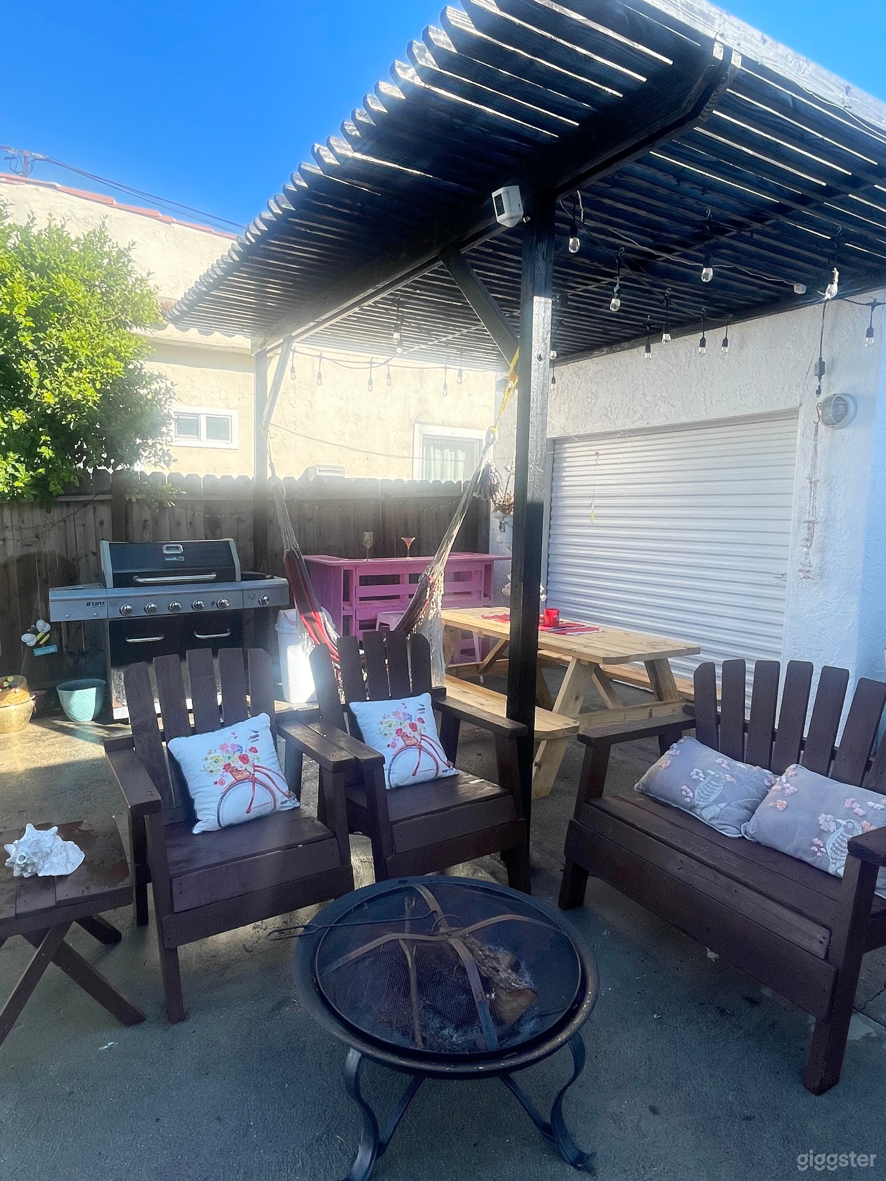 The BBQ area features a charming wood frame, providing a perfect outdoor setting for film scenes or a relaxing space for the crew to enjoy during breaks