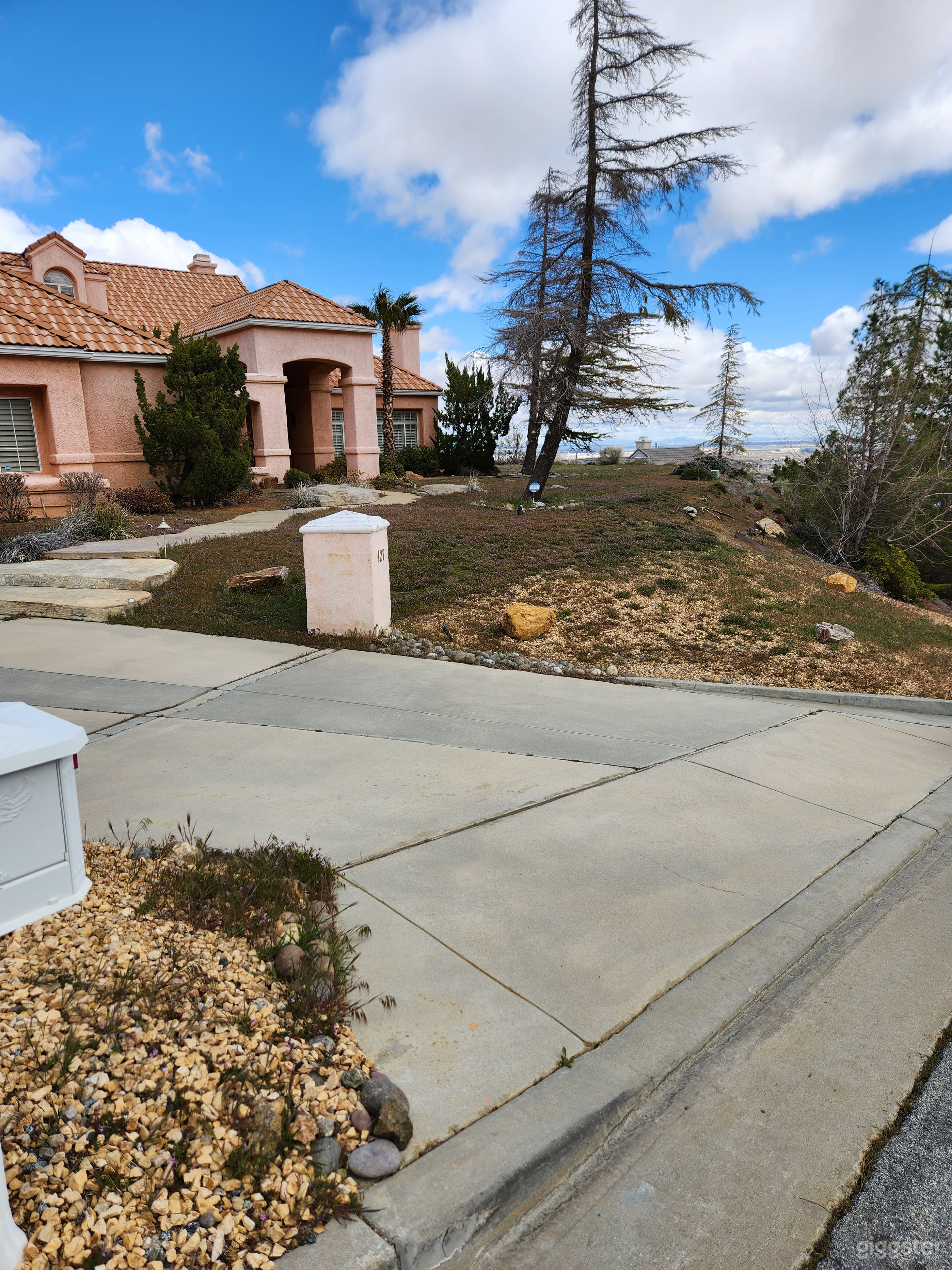 Front of house and part of the driveway.