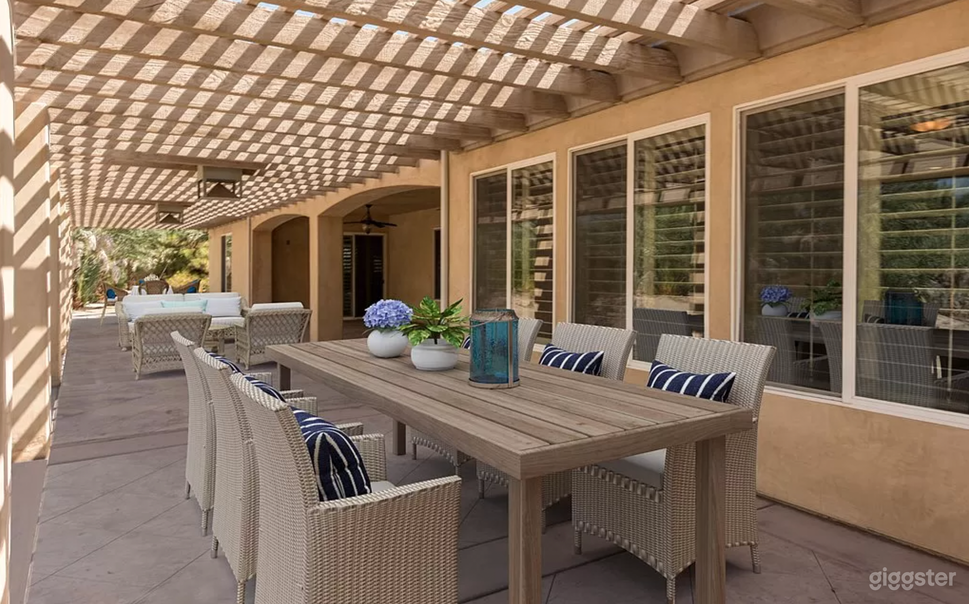 Rear patio with seating. Easily set for dinner with 50 guests or more.