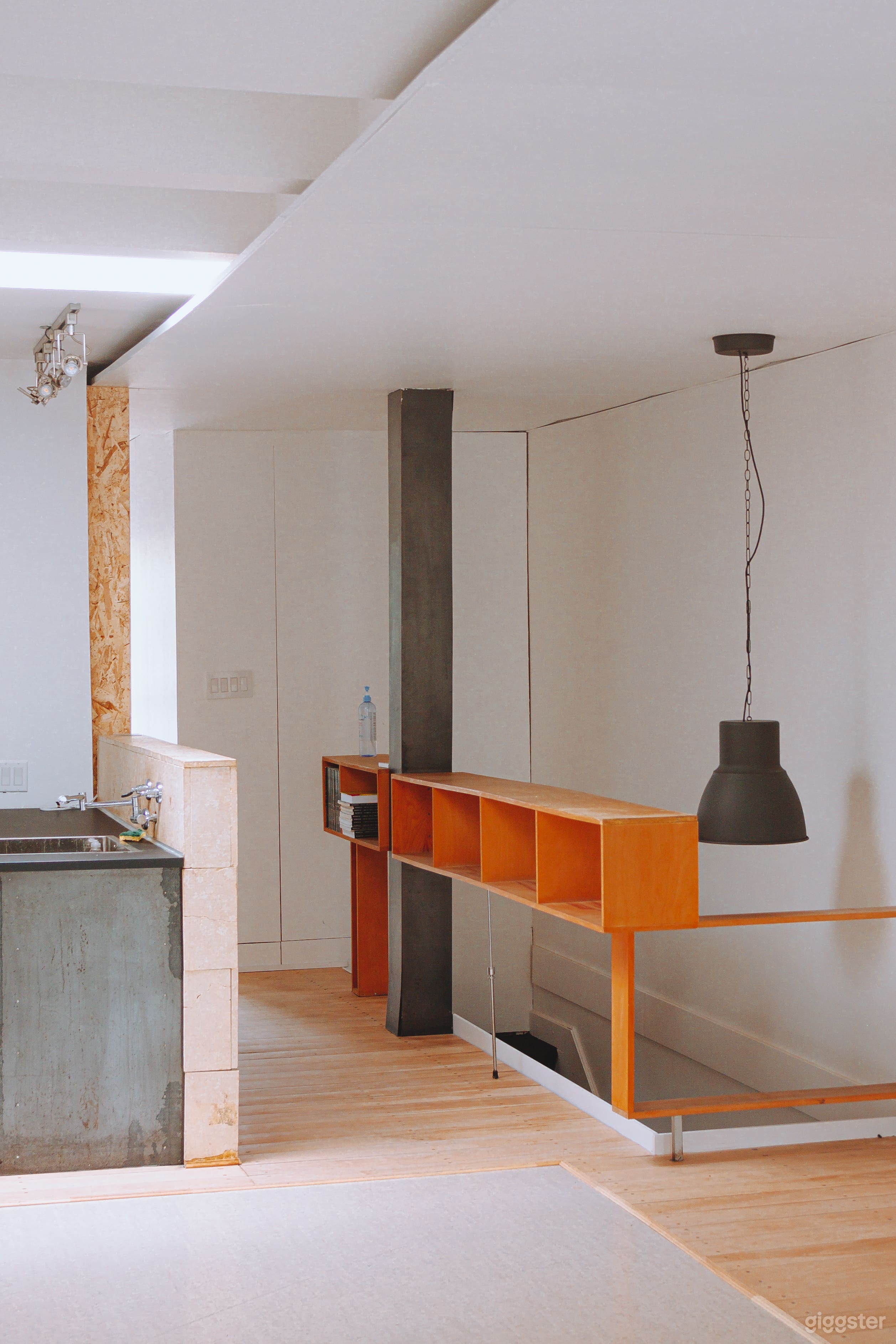 This is where people come upstairs. To the left is a kitchen area.