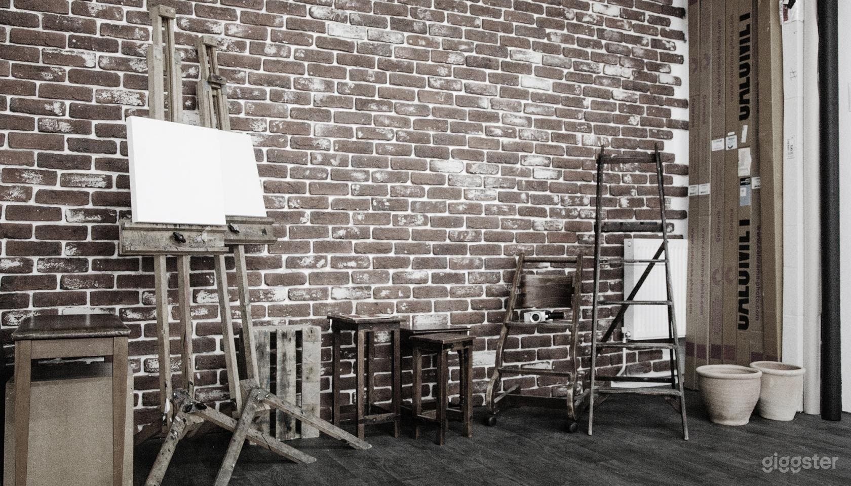 Monochromatic Brick-walled Photo Studio with Abundant Lighting Photo 2