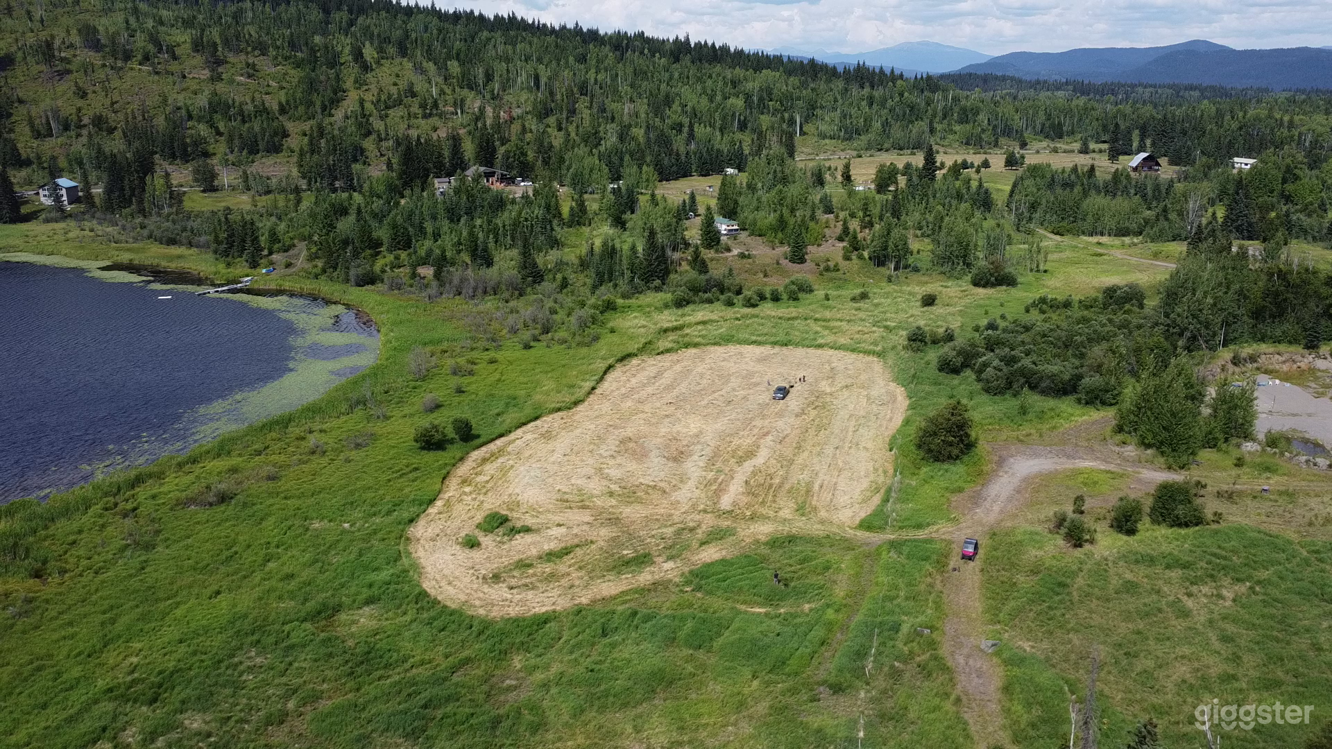 Aerial photo facing north starting at the most southern tip of our property.   We own right up to the top of the mountain.   You can just make out the volleyball courts, cabin, teepee, workshop, and barn.