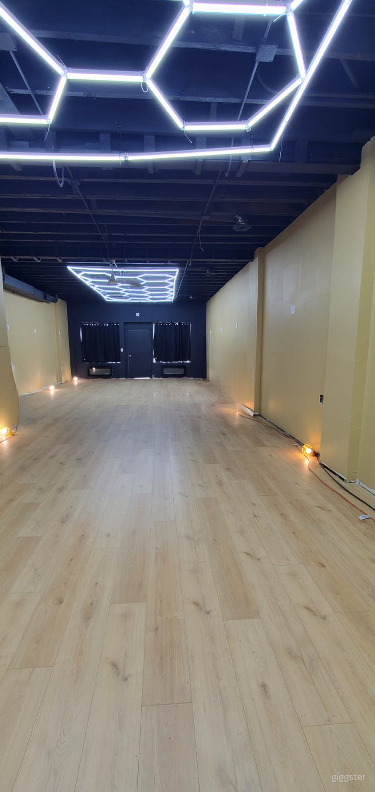  Space picture with black out curtains drawn for your party privacy, there are 2 fireplaces in the front if you want a seating area for decore 